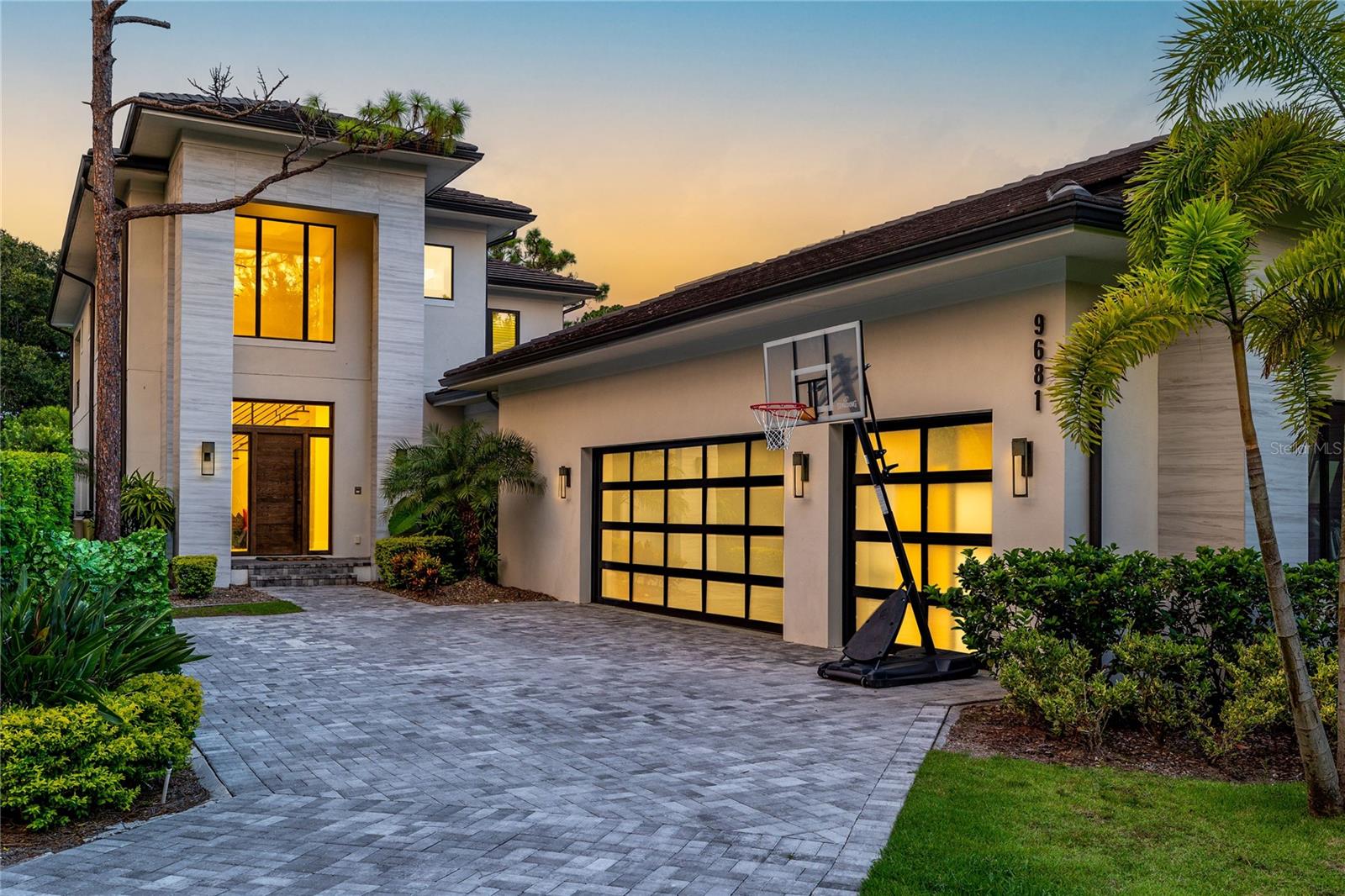 Under contract-accepting backup offers. Introducing a luxurious and exceptional property nestled within the highly-esteemed Lake Nona Golf & Country Club. Experience the pinnacle of refined living in this magnificent home that embodies elegance, sophistication, and the finest in contemporary design. Built by Barcellona Homes in 2020, this two-story home offers a seamless flow between interior and exterior living. Boasting 5 bedrooms, 5 full bathrooms, and two half bathrooms, this residence spans an impressive 4,565 square feet of meticulously designed living space.
Elegance and functionality seamlessly converge on the main level, featuring a grand main suite and a guest suite, providing privacy and comfort for family and visitors alike. The star of the kitchen is a waterfall Cambria island, surrounded by Thermador appliances and facing a view of the backyard pool.
Ascend to the upper level, where a sprawling bonus room and a screened balcony provide additional living and entertaining space. Each of the three guest suites upstairs are appointed with a full-sized bathroom and walk-in closet.
This home showcases a multitude of upgrades and custom-built features, embodying the epitome of luxury living. The three-car garage is a haven for car enthusiasts, equipped with a dedicated air conditioning system and extra insulation throughout the walls. Ample built-in storage ensures effortless organization and convenience.
Step into a private oasis as you venture outdoors, where a resplendent backyard pool awaits. The large covered porch with a summer kitchen beckons you to savor alfresco dining and embrace the idyllic Florida climate all year long. Adding to the allure, a dedicated outdoor pool bathroom offers added convenience for you and your guests.
Every detail of this residence has been thoughtfully considered, including a private laundry in the owner's suite, offering a luxurious touch of convenience.
Lake Nona Golf & Country Club, a highly sought-after community, is centrally located in Orlando, Florida, offering short commutes to the airport, downtown, and popular attractions such as Disney and Universal. Renowned for its impeccable design, the challenging golf course, designed by premier golf architect Tom Fazio, has garnered a reputation among professional golfers and world-class athletes who call Lake Nona home.
This distinctive property presents an extraordinary opportunity to indulge in a lifestyle of luxury, privacy, and exclusivity. For more information, or to set up a private tour, contact your Realtor® today.