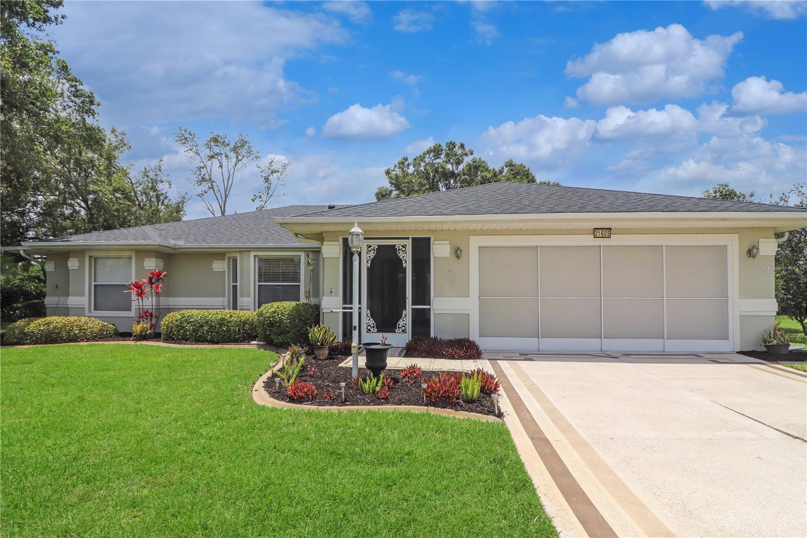 Spacious and well-designed, this Princess model sits proudly on an oversized corner lot in the desirable 55+ gated community of Royal Highlands. Built with quality and ready for your personal touch, this home features a 2021 roof and a welcoming screened front entry. Inside, you’ll find a formal living room and dining room—perfect for entertaining—as well as a large, functional kitchen complete with a closet pantry, ample counter space, and a cozy breakfast nook. The adjoining family room offers a comfortable space for casual living. The primary suite includes a walk-in closet and a spacious ensuite bath with dual-sink vanity, garden tub, and separate shower. A private guest wing provides two additional bedrooms and a full guest bath, offering flexibility for guests or a home office. Volume and cathedral ceilings add to the open feel throughout, while the inside laundry room and screened lanai provide added convenience and comfort. A two-car garage completes the layout. Residents of Royal Highlands enjoy access to a wide array of amenities, including indoor and outdoor pools, lighted tennis courts, an 18-hole golf course with on-site restaurant and pro shop, fitness center, activity rooms, library, billiards, and a grand hall for concerts, plays, and community events. Additional recreational options include bocce ball, pickleball, shuffleboard, softball, a driving range, and putting green. The HOA fee covers Xfinity cable for up to three TVs, high-speed internet, and secure RV and boat storage. Conveniently located near the Florida Turnpike, with easy access to Orlando attractions, the airport, and the nearby Orlando Health South Lake Hospital Emergency Center, this home offers both comfort and a vibrant lifestyle.