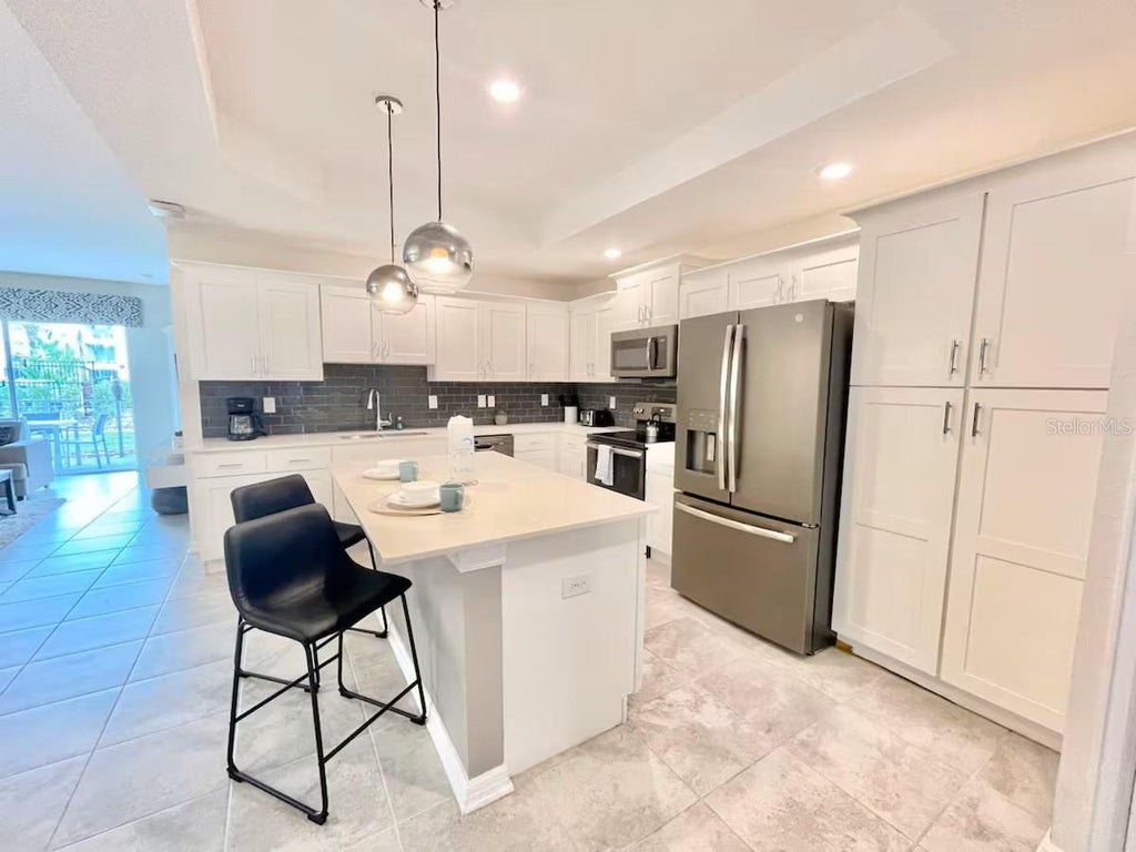 Photo of 3120 Paradox Circle #101, Kissimmee, FL 34746 (MLS # O6439562)