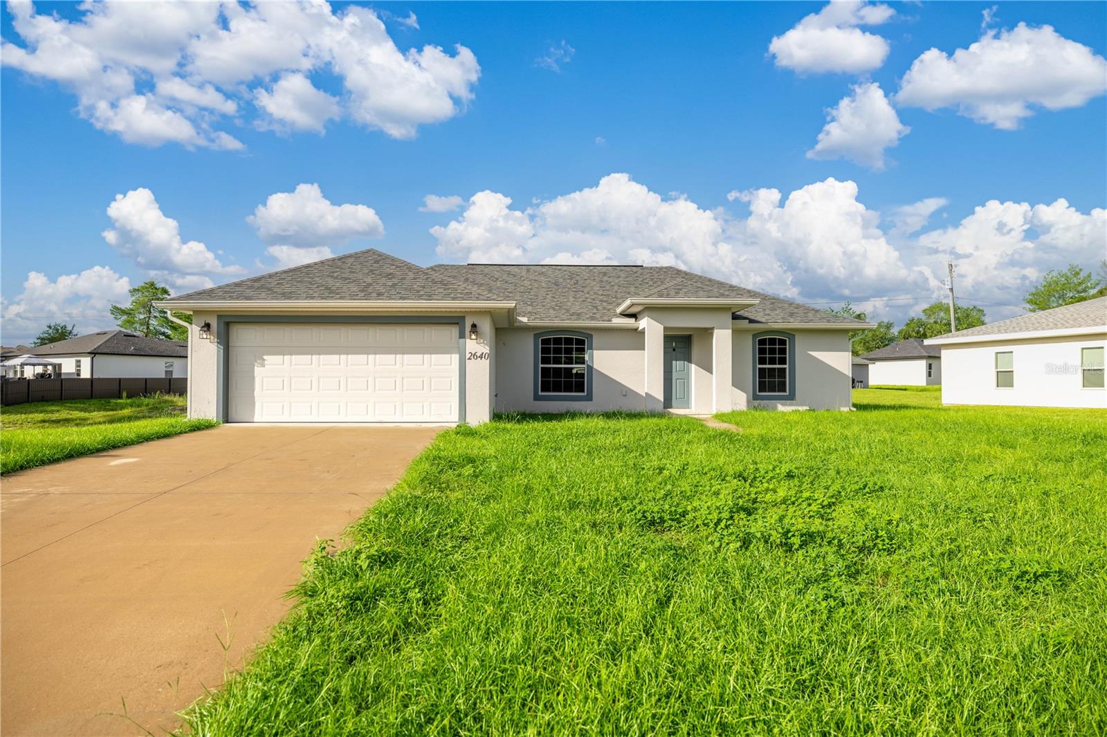 Owner motivated! $$ Priced to sell $$ Why wait months and months for new construction when this gem is MOVE IN READY!? NO HOA OR AGE RESTRICTIONS! Welcome to this charming 3-bedroom, 2-bath home nestled in a popular and affordable community, where you'll find the perfect blend of comfort, convenience, and freedom. Set on a generous quarter acre plot of land, this property offers an unparalleled sense of independence and versatility. Step inside and be greeted by a thoughtfully designed interior boasting a split floorplan and high ceilings. Brand new luxury vinyl plank flooring and paint throughout. This layout ensures privacy and a seamless flow throughout the home, making it ideal for families or those who desire space for guests. The cozy bedrooms are strategically positioned, allowing everyone to enjoy their own retreat within this delightful abode with a walk in shower and closet. The heart of the home revolves around the modern amenities and updates that have been carefully incorporated. The spacious kitchen is a haven for culinary creativity, equipped to cater to any chef's desires with stainless appliances, farms style sink, and granite countertops. The adjacent living and dining areas are open and inviting, creating a welcoming space to entertain and make lasting memories with loved ones. Step outside into the expansive, backyard, a haven for outdoor enthusiasts and pet owners alike. With plenty of space to run and play and build a pool, the possibilities for creating your own outdoor oasis are limitless. Whether it's gardening, hosting BBQs, or simply enjoying the fresh air, this backyard with a 10x10 screened lanai is a blank canvas waiting for your personal touch. The location of this home is truly unbeatable. Centrally situated in a thriving and sought-after community, you'll find yourself just moments away from an array of conveniences, entertainment, and amenities. Restaurants, shopping centers, parks, and schools are all within easy reach, ensuring that you have everything you need at your fingertips. In this home, you'll relish the freedom to embrace your lifestyle and preferences without the constraints of an HOA or age restrictions. Whether you're a first-time homebuyer, a growing family, or simply looking for a comfortable place to call home, this property offers a warm and welcoming environment that you'll be excited to call your own. Don't miss this incredible opportunity to own a 3-bedroom, 2-bath home with a big fenced backyard, new roof and flooring and the freedom to live life on your terms in a popular, centrally located, and affordable community. Embrace the possibilities and make this house your perfect home.