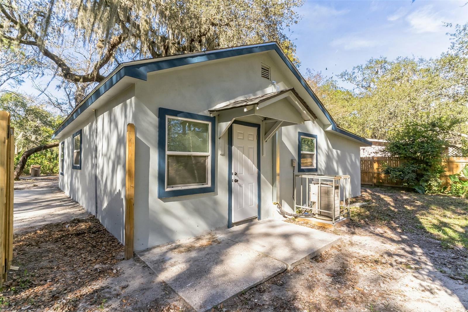 Below appraisal value! Situated on almost half an acre of Private land backing up to a preserve type water large multi acre feature giving a feel of endless nature paradise. Mature Gorgeous Oak Trees welcome you to an updated and renovated cozy retreat nestled near the charming downtown of Groveland, situated in the picturesque landscape of Lake County. This quaint but tastefully decorated 3-bedroom, 2-bathroom home embodies the allure of small-town living, offering a perfect canvas for your vision and creativity. Step inside to discover a warm and inviting atmosphere, with an open living space that radiates potential. Beyond the inviting interior lies a spacious plot of land, providing ample room for outdoor activities, gardening, or potential expansion. Located near downtown Groveland, residents can revel in the ease of access to local shops, dining venues, and community events, fostering a true sense of belonging within this tight-knit community. Lake County's breathtaking natural beauty surrounds this property, offering scenic views and an abundance of outdoor adventures, from hiking trails to serene lakeshores, inviting residents to explore and immerse themselves in nature's embrace.