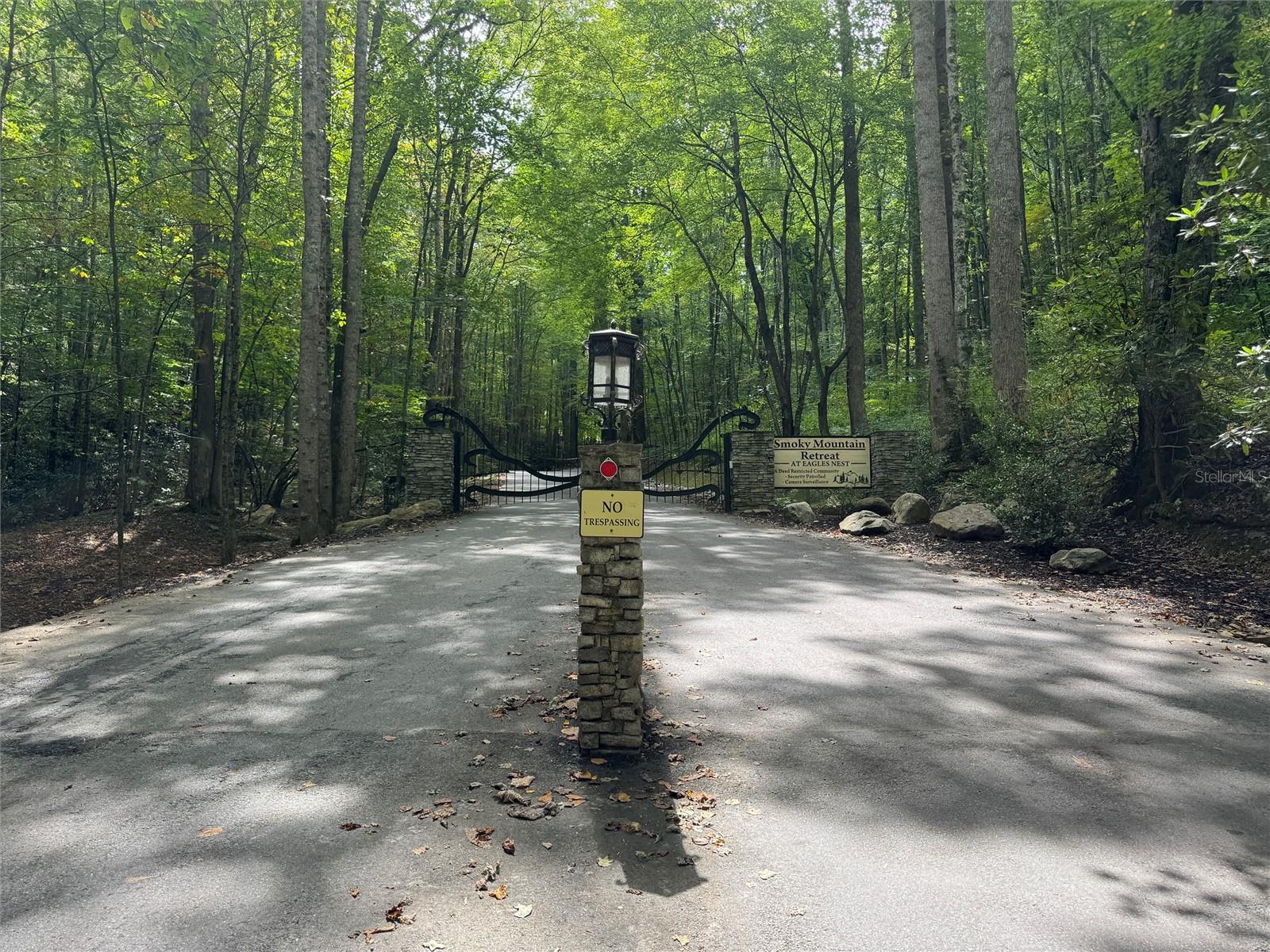 Come and experience this beautiful 1.3-acre lot in the beautiful Smoky Mountain Retreat at Eagles Nest community. Nestled in the heart of Maggie Valley, this property offers both breathtaking mountain views and a serene wooded setting. Imagine waking up each day to stunning vistas, cool breezes, and colorful sunsets over the Blue Ridge.
This gated community is designed for true mountain living, with two separate entrances — one leading to Maggie Valley and the other to Waynesville — giving you easy access to both towns. Residents enjoy a wealth of amenities, including , a waterfall hiking trail, playground, and a beautiful rustic barn perfect for gatherings, events, and community celebrations. Underground utilities, fiber optics, cable, internet, and county water are available for your convenience.
With plenty of space and privacy, this lot is the perfect canvas for your dream mountain retreat, whether you envision a cozy getaway cabin or a lasting family legacy home. Don’t miss the opportunity to own a piece of paradise in one of Western North Carolina’s most sought-after gated communities.