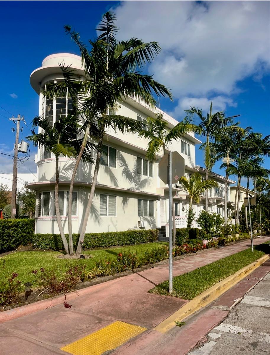 Under contract-accepting backup offers. Timeless Art Deco Gem in the Heart of Miami Beach
Nestled just off iconic 41st Street—steps from top-rated dining, boutique shopping, and direct access to the sand—this classic 1947 Miami Beach property showcases true Art Deco character with vintage charm and modern upkeep.
The building includes a total of six units, thoughtfully laid out to highlight the style and architecture of the era. Four of the residences are one-bedroom, one-bath units, each featuring a unique blend of original tile and wood flooring that reflects the building’s Deco roots. A spacious two-bedroom, one-and-a-half-bath unit spans approximately 1,000 sq ft, offering similar finishes and flow.
The crown jewel of the property is a dramatic two-story apartment measuring 2,000 sq ft, designed with grand scale and rich character. The main level boasts soaring 24-ft ceilings in the living room, a formal dining space, a retro-inspired kitchen, private laundry, full bathroom, and a classic wet bar. With its own front and rear entrances, the unit offers both privacy and flexibility. Upstairs, two generous bedrooms each feature en-suite Deco-style bathrooms and private rooftop terrace access—a rare feature with skyline views of Miami Beach.