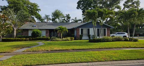 Photo of 1469 Treetop Dr, Palm Harbor, FL 34683 (MLS # TB8504484)