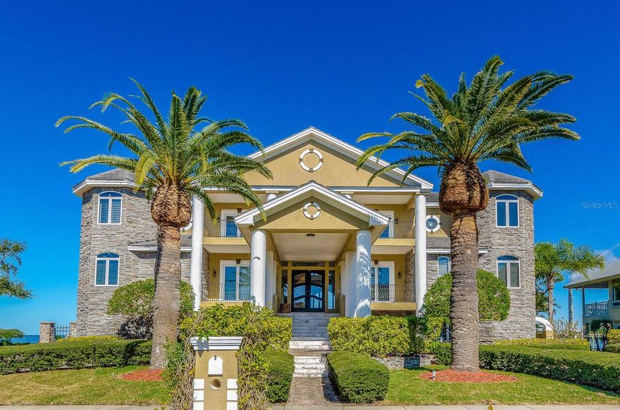 One or more photo(s) has been virtually staged. EXCEPTIONAL WATERFRONT HOME NOW AVAILABLE! SELLER IS ALSO OFFERING OWNER FINANCING OR A LEASE-PURCHASE OPTION TO BUY! Located in the exclusive, guard-gated community of Harbour Watch, this 5-bedroom, 6-bath waterfront home with an elevator offers outstanding Gulf and Anclote River basin views the moment you walk in. The layout, size, and features make this home ideal for anyone looking for comfort, space, and true waterfront living. The kitchen is set up for serious cooking and entertaining, with a commercial-grade cook station, a separate hibachi-style station, and Sub-Zero refrigerator and freezer units. The open design makes meal prep and gatherings easy. The home also includes a theater/movie room for relaxing and a large game room with its own second full kitchen, perfect for hosting family and friends. The great room features beautiful water views, built-in cabinetry, a fireplace, and an open flow to the kitchen. The primary suite is a true retreat with Gulf views, custom built-ins, a fireplace, and a private balcony. A spiral staircase from the balcony leads up to a 4th-floor widow’s watch with incredible open-water views. All secondary bedrooms are generously sized and include their own private bathrooms and walk-in closets with built-ins.
Additional features include three butler’s stations, two laundry rooms, and elevator access to all levels. The 4-car side-entry garage provides plenty of parking and storage. Outside, the home includes a large dock with a lift for a sizable boat, plus additional lifts for smaller watercraft.Harbour Watch offers 24/7 guarded entry along with a pool, spa, clubhouse, tennis and pickleball courts, and a playground. The location is close to shopping, dining, beaches, and essential services, and is about 45 minutes from two major airports, providing both privacy and convenience.