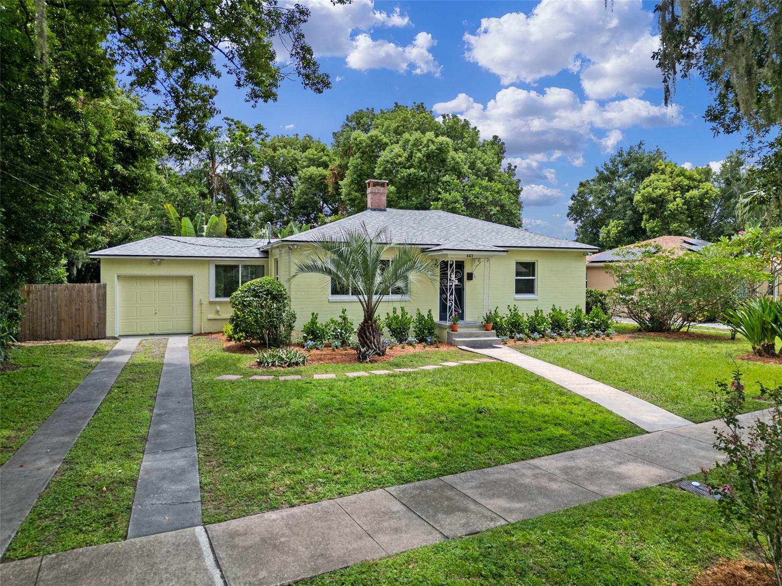 Lovingly owned by the same family for decades, this 3BR/1BA Lake Como bungalow blends 1940s character with thoughtful updates! Original wood floors grace most of the home, while the remodeled kitchen and breezeway dining room feature modern ceramic tile. The iconic 1940s blue tile bath has been preserved for your enjoyment. Updates include a 2018 roof, updated electrical panel, 2020 AC with all-new ductwork, hurricane-rated windows (warranty), and new faux wood blinds. Freshly painted with storage & linen closets, a 2015 water heater, washer (no dryer), and a 1-car garage. The rear bedroom offers serene views and natural light overlooking a professionally landscaped, fully fenced backyard—a very private oasis with multiple sitting areas perfect for BBQs, garden gatherings, or afternoon tea. Surrounded by Philippine violet, frangipani, guava, Surinam cherry, plumbago, pindo palm, night blooming pencil cactus and more, it’s a gardener’s dream with room to personalize. No flood zone! Minutes to Downtown Orlando, the Milk District, parks, and Lake Como Elementary. Don’t miss this rare chance to own a piece of Lake Como charm—schedule your showing today!
