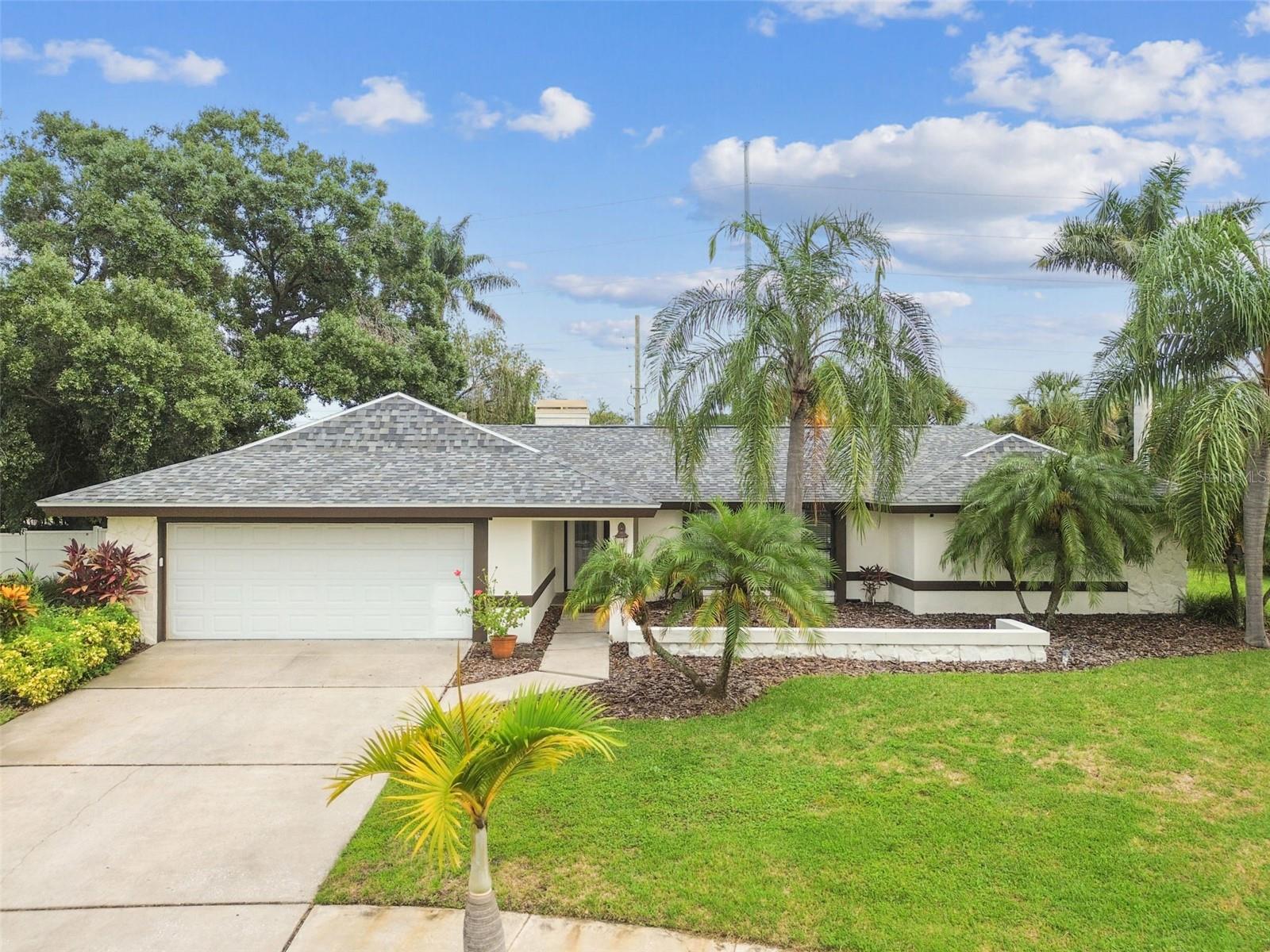 Waterfront Home located in the exclusive gated community of Sweetwater. This 3 Bedroom 2 Bath Home is great for family entertainment with a private waterfront dock with direct boat access to the Bay and Screened Enclosed Pool with Waterfall. There is also a Sitting and Firepit area adjacent to the pool. This home features an open floor plan of just under 2,600 sqft of living area, with a split bedroom plan, updated kitchen with granite countertops, breakfast bar with dining area, and living room with fireplace and vaulted ceilings. Hardwoods and Tile flooring throughout the home. Demensional Shingle Roof was replaced in 2017, the HVAC System was replaced in 2021, in addition to a Water Conditioning and Reverse Osmosis System. One of the best locations in Tampa with close proximity to Downtown Tampa and adjacent to Westshore Business District with high end restaurants, entertainment, shopping at International Mall, and Tampa International Airport.