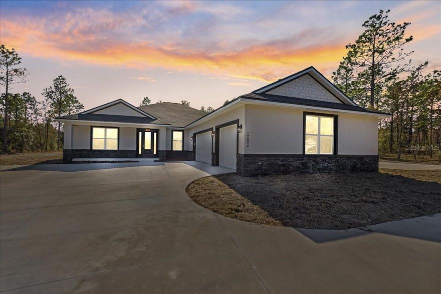 Pre-Construction. To be built. If you’ve been waiting for acreage, a 3-car garage, and the ability to build it your way. This stunning pre-construction floorplan also features a MUDROOM WITH A HALF BATH, OVERSIZED L-SHAPED PANTRY AND LAUNDRY ROOM PLUS COFFEE AND WINE BAR. The Tranquility home offers over 2,300+ sq ft of light-filled, open-concept living with soaring vaulted ceilings and windows that create a bright, airy feel buyers love. The chef-inspired kitchen features a statement island, granite countertops, 42” soft-close cabinetry, stainless steel appliances, hood and pot filler. The split-bedroom layout delivers privacy, while the primary suite feels like a retreat with tray ceilings, dual closets, soaking tub, and spacious spa-style tiled shower. A French-door office, mudroom with coffee/wine bar, walk-in pantry, and 3-CAR GARAGE make everyday living effortless. Enjoy true indoor-outdoor Florida living with a 26’ x 12’ covered lanai and welcoming front porch overlooking natural surroundings. Flexible financing options available- VA and Conventional construction-to-perm loan through the builder’s preferred lender, or cash with construction draws ONLY. TO-BE-BUILT... which means you can still select finishes and make it yours. Once construction begins, personalization ends. If acreage living is on your radar this year now is the time. Build it your way. Or watch it get built for someone else. Photos and video shown are from a similar model home. The following features shown are buyer-paid upgrades: additional extension of the standard 26"x12" lanai, additional driveway to the RV pad, RV pad, garage utility sink, expanded living room windows, shower niches, and luxury vinyl plank flooring in bedrooms