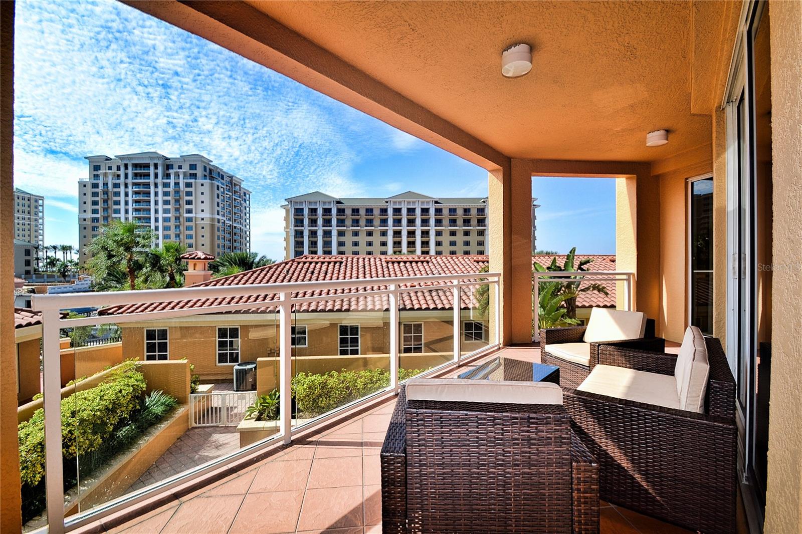 Experience luxurious coastal living in this spacious 3-bedroom, 2.5-bathroom condo located in the stunning Belle Harbor community on Clearwater Beach!! Situated on the 4th floor of the Windsong Tower, this quiet corner unit is southwest-facing and filled with natural light thanks to floor-to-ceiling sliding glass doors. The condo features a generous kitchen with granite countertops, stainless steel appliances, breakfast bar, and eat-in dining area—perfect for entertaining or relaxed mornings. The master suite includes its own private balcony with partial Gulf views, a large en-suite bathroom with dual sinks, garden tub, separate shower, and an oversized walk-in closet. You'll enjoy the convenience of a full inside laundry room, under-building assigned parking, and a climate-controlled storage unit. Belle Harbor is known for its Mediterranean-inspired design and resort-style amenities, including a two-story waterfront clubhouse, fitness center overlooking the marina, billiards room, and a stunning heated pool and spa. Relax on the poolside veranda with grilling stations, TVs, and fireplaces, or take in the views from the beautifully maintained grounds. The community offers 24/7 manned security and is gated for added peace of mind. Just steps from the sugar sands of Clearwater Beach, this condo blends luxury, comfort, and location—ideal for those seeking a high-end long-term rental in one of the most desirable areas on Florida’s Gulf Coast.