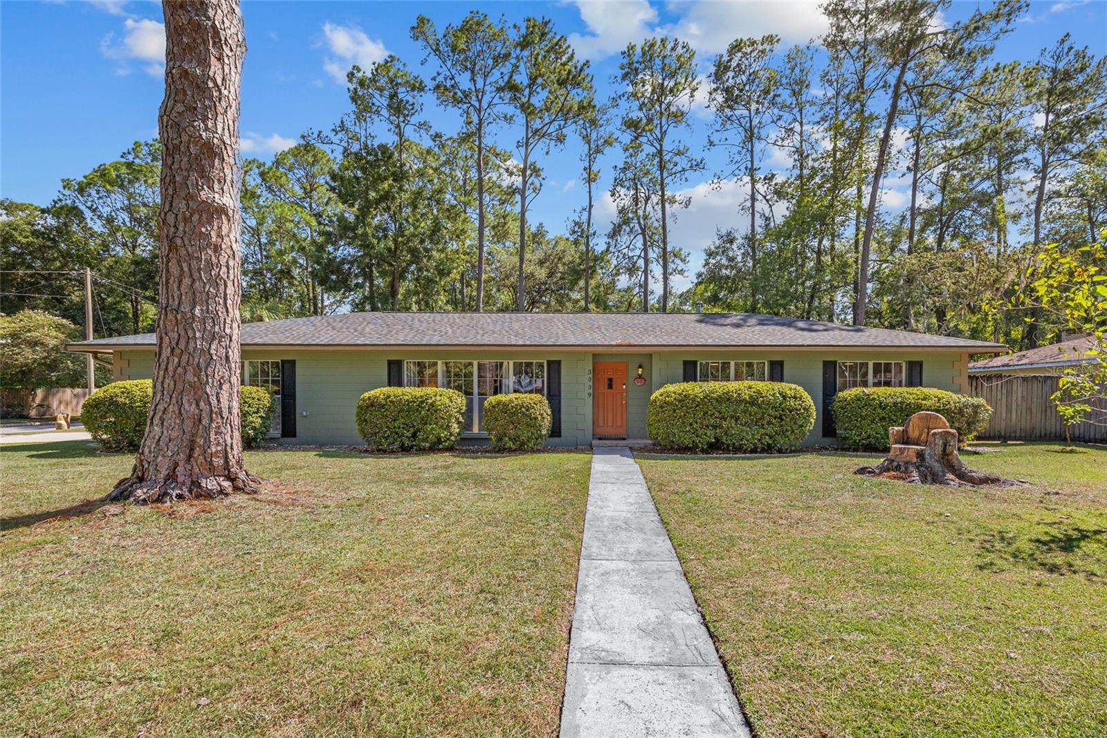 Looking for a great home in the perfect location? Don't miss this beautifully updated, well maintained home conveniently located in the center of NW Gainesville. Located near shopping, schools, nature trails, and UF and Shands hospital. Includes 4 Bedrooms, 2 Bathrooms with 1962 SF of conditioned space. This home's orientation offers amazing natural light and has been thoughtfully cared for. Gorgeous luxury vinyl plank flooring throughout and installed in 2024, newly painted with a Huge kitchen designed for the chef in the family that includes raised panel cabinets, Granite countertops, stainless appliances, reverse osmosis water system and a spacious walk-in pantry with solid shelving. Updated bathrooms with designer tile and granite countertops. Owners bath includes a large walk in shower with upgraded tile. This home is well built and energy efficient. Concrete Block construction with a brand new roof and solar panels. Huge corner lot with a partially fenced backyard, spacious storage shed, garden space,and fruit trees. There is a large back patio that includes a relaxing oversized hot tub and swim spa providing an oasis for quality family time. This home is the perfect choice if you are looking for a convenient location with luxury finishes. Move In ready! Call us today to schedule an appointment to see it!