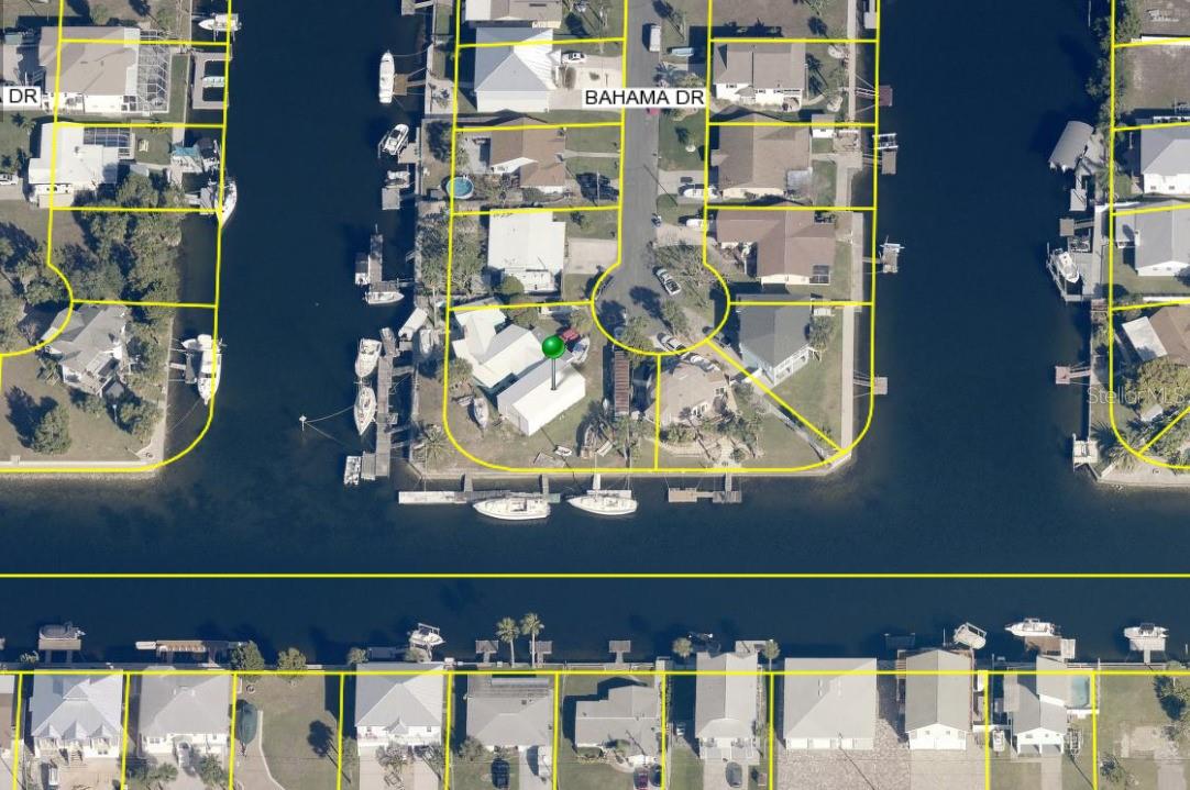 Investor alert! This 2-bedroom, 2-bath waterfront home in the highly desirable coastal community of Hernando Beach sits on a rare double lot with 2 private boat docks, a boat lift and direct Gulf access just a 1-minute boat ride away—perfect for boating enthusiasts or vacation rental potential. One lot can be used and the other rented or you can enjoy both! The master bedroom has double sinks and even has a fireplace in the living-room. The home needs TLC and has storm damage, but offers incredible upside in a stunning marina neighborhood known for its laid-back lifestyle and natural beauty. Enjoy sweeping 180-degree canal views from the enclosed back lanai, ideal for relaxing evenings or morning coffee with a breeze. Whether you're looking to create your dream coastal retreat or capitalize on an income-producing investment, this is a prime location. Call for inquiries today!