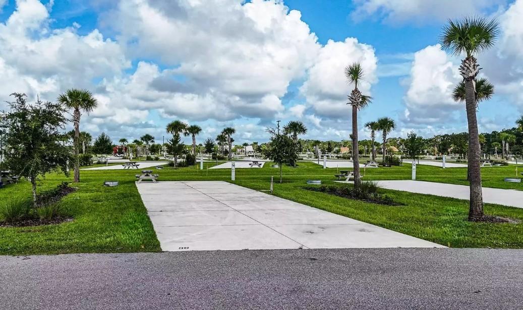 Welcome to Resort at Canopy Oaks, a brand new, modern, upscale RV Resort in Central Florida! Canopy Oaks sits on 435 acres filled with everything that you will need for your perfect RV experience. Enjoy first-class amenities such as a Resort style pool, hot tub, large tiki bar w/ full bar and sound system, live entertainment, tournament-style pickle ball courts, a spacious clubhouse, onsite cafe/deli and general store, fishing pond, on-site professionally managed activities, access to ILE Golf Course, large RV and Tiny Home/Cottage sites, pet and guest walking areas and free Wi-Fi throughout the resort! There is a professional on-site Management company to manage your Lot rentals if you would like to rent your Lot out when not in use!
Each site comes with a concrete pad and is able to be upgraded to your liking! Add lush landscaping, a tiki hut, pavers, outdoor kitchen and seating areas and more! Make your RV Living dreams come true! All sites have 20-30-50 amp service and the monthly fee of $350 (billed quarterly) includes water, sewer, trash, electric, wi-fi, and landscape services. Cable TV is provided in common areas. Each owner pays respective property taxes to the County.
If you are an RVer and are looking for a home base in Florida, look no further than Resort at Canopy Oaks!