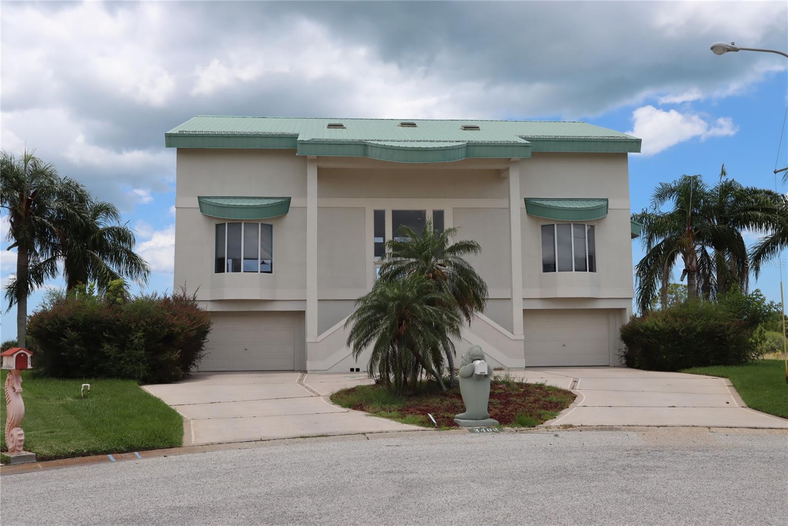 Welcome to Hernando Beach South, now a golf cart community with a 30 mph speed limit to allow for safe access to all the dining and amenities of the area. Turn onto Amberjack Drive then you’ll see this amazing home nestled at the end of the cul de sac. SITUATED ON A WATERFRONT LOT WITH STUNNING VIEWS of the Florida Gulf. One of the best views in Hernando Beach. A double driveway with 2 separate 2 car garage doors opens into 1,768 square feet of unfinished garage and storage space. This structurally sound house never received any flooding or wind damage from the hurricanes. THIS AMAZING HOME IS OVER 2,800 SQ FEET WITH 3 BEDROOMS, 2 FULL BATHS AND A LOFT. The main living area is on the second level with large great room with open ceiling to the third level and windows that allow for an abundance of natural light. BRAND NEW INSIDE AIR HANDLER & OUTSIDE CONDENSER. The kitchen has a breakfast nook with bay windows and a dining room on the adjacent side of the kitchen. The great room has French doors that open out to the covered lanai that presents the best feature of this home, an unobstructed view of the protected wildlife sanctuary. WATCH BREATHTAKING SUNSETS, birds and water creatures while enjoying the tranquil resort style living. There are also 2 large bedrooms, a full bath, laundry room and storage closet on this level. The third level has an impressive open loft with built in desk and cabinets that overlooks the great room, also features a large storage closet with center cabinets. The loft also has French doors that open to a covered deck. Balcony walkway to the Primary Suite This Primary suite is spacious with an ample size walk-in closet with another center cabinet for extra storage. Enjoy an additional covered deck with French doors from the Primary. Built in 2000 by the original owners, this home has great potential and will require some updates. There is an HOA with minimal dues that protects you from short term rentals and unsightly yard debris on this side of Hernando Beach. Backyard includes a covered patio with mature landscaping. Dream location for boating, watersports and fishing. You’ve got to come see for yourself!