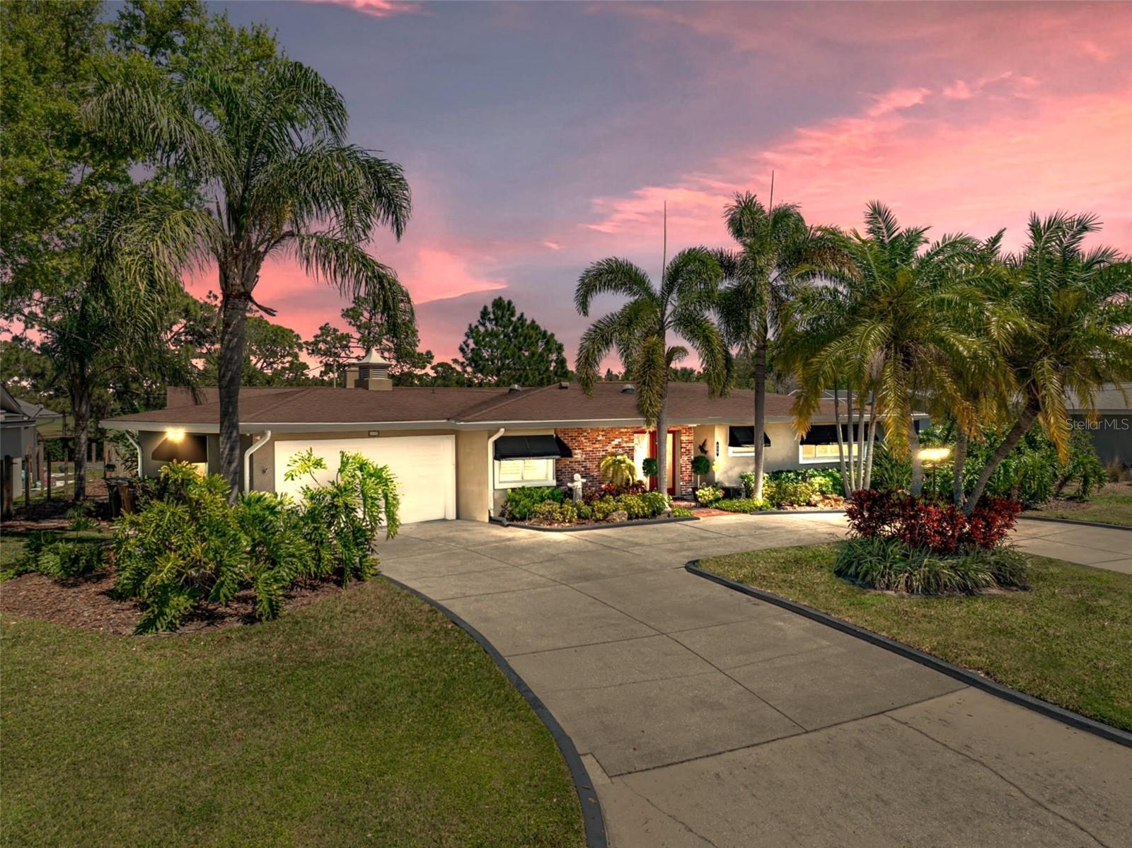 LUXURY GOLF COURSE LIVING awaits with this beautifully updated estate home, ideally situated on the 5th fairway of the Pelican Golf Course, offering stunning views and serene Florida sunrises. From the moment you arrive, you are greeted by the home's charming exterior, vibrant landscaping, and a circular driveway that sets the tone for the exceptional spaces inside.
Step into an open and bright floor plan designed with both style and functionality in mind. Soaring vaulted ceilings, with exquisite wooden beams and oversized windows throughout, fill the home with warm and natural light.
At the heart of the home is the spacious kitchen, complete with beautiful maple cabinetry, SS appliances, and an expansive breakfast bar. The walk-in pantry ensures ample storage, while the intimate cafe nook offers a charming setting for casual dining. Directly off the kitchen is a private courtyard, fully fenced for added privacy (NEW PVC FENCE, April-2025). This peaceful outdoor space, accessible from both the kitchen and primary suite, offers a secluded escape perfect for enjoying your morning coffee or simply relaxing outdoors.
Just beyond is the dining room, complete with a built-in wet bar, beverage refrigerator, and additional bar seating. It provides the ideal setting for both intimate soirées and grand celebrations. Adjacent to the dining room is a tranquil alcove that offers a cozy space to unwind. The family room showcases a magnificent stone fireplace providing an inviting space for conversation or relaxation, with large windows framing sweeping views of the golf course that brings the outdoors in.
The primary suite is thoughtfully positioned on the left wing of the home, ensuring maximum privacy. This luxurious retreat boasts oversized windows, dual closets (A custom Walk-Through closet & an additional spacious custom Walk-In closet with direct access to the courtyard), and a beautifully renovated ensuite bathroom. This luxurious ensuite features a sleek, freestanding soaking tub, dual vanity sinks, and a generously sized walk-in shower, providing a true sanctuary.
Three secondary bedrooms: The front bedroom is appointed with custom built-in dresser drawers and a custom walk-in closet, that share a charming Jack-and-Jill bath with the second bedroom. The third bedroom, located at the rear of the home, is oversized and host 2 closets. Although, it is currently being used as a cozy den it could easily function as a second primary suite or an in-law suite, with a full bath that is just steps away.
The private backyard oasis is encased by a charming white picket fence and offers panoramic views of the fairways. This quiet haven offers the perfect setting for both grand gatherings or just watching golfers pass by.
**NOTABLE MENTIONS: This home sits 45+ feet above sea level, NO FLOOD ZONE, NO FLOOD INSURANCE REQUIRED, Situated on the 5th Fairway, Double-Pane Windows, Storm Shutters, Plantation Shutters/Honeycomb Blinds, Electrical Panel Wired for a Generator, NEW A/C (2023), NEW Roof (April 2025), NEW PVC Fence (April 2025), NEW HOT WATER HEATER (April 2025), Workshop & ½ Bath in Garage, & so much more!
Call today for a private tour of this exquisite, 'worry free--stress free' home and start enjoying all the amazing things that Belleair has to offer. Just around the corner from the prestigious Pelican Golf Country Club, sugar-white Gulf beaches, fine dining, fabulous boutiques, and just a few minutes from Tampa International Airport.