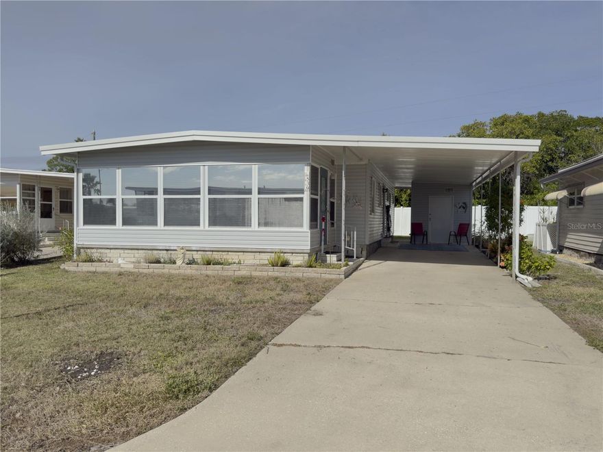 This well maintained home built in 1973 offers 1074 sq ft of living space and comes fully furnished, making it the perfect turnkey option for seasonal or year-round living.  This home features 2 spacious bedrooms, a functional kitchen and eating area, and a large lanai.  The master bedroom has an en-suite bath with updated walk-in shower (no tub) & vanity, as well as a large walk in closet.  The guest bath has tub/shower combination, perfect for visitors.  Additional upgrades include Roof (2022), and Flooring (2020).  The air conditioned lanai, with window treatments and updated flooring offers an peaceful place to relax, perfect to greet and entertain guests.  Home is located in Americana Cove, a 55+ waterfront community with low $380 HOA, which includes water, sewer, trash, lawn mowing & edging, heated pool, shuffleboard, bocce, and updated fitness room.  Lots of clubs and activities.  Close to downtown St Pete (10 min), 15 min to 2 airports,  15 min to beaches.  This home is ready to move in and enjoy the Florida lifestyle.