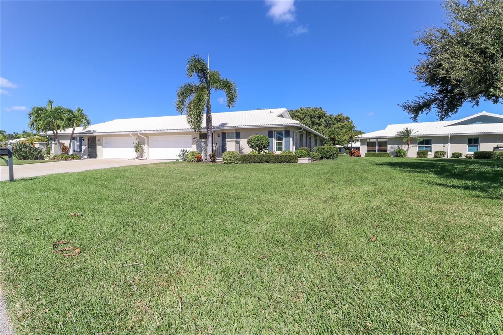 Enjoy the ultimate Florida lifestyle in this popular 55+ Village Green paired villa, ideally situated on a quiet cul-de-sac in West Bradenton—just 5.7 miles from the beautiful beaches of Anna Maria Island. This welcoming community is not in a flood zone, offering peace of mind along with a relaxed coastal vibe.
Step inside and discover 1,913 square feet of air-conditioned living space with an inviting glass-enclosed Florida room overlooking a tranquil greenbelt. The open, spacious floor plan features two oversized bedrooms with generous storage, a bright living and dining area, an eat-in kitchen, and a two-car garage. A charming wrought iron gate secures the front entry, adding both privacy and appeal.
Recent updates enhance the home’s comfort and style, including a new tile roof, updated windows, granite kitchen countertops, a stainless-steel double sink, and pull-out cabinet drawers. The kitchen also offers a large pantry with pull-out shelving. Both bathrooms have been tastefully renovated, and the home features fresh interior paint and new laminate flooring throughout—no carpet. Laundry is conveniently located just off the kitchen, and the unit comes equipped with a water system.
This land-owned property includes a $350 monthly condo fee (paid quarterly), covering basic cable TV, internet, exterior painting, annual roof cleaning, common area taxes, community amenities, escrow reserves, grounds maintenance, landscaping, exterior pest control, and pool upkeep. Centrally located, the villa offers quick access to shopping centers, medical facilities, a wide array of restaurants, G.T. Bray Park, Robinson Preserve, the Downtown Riverwalk, and the Gulf beaches. Nearby airports include Sarasota Bradenton, Tampa, and St. Pete. For your private showing, contact the listing agent today.