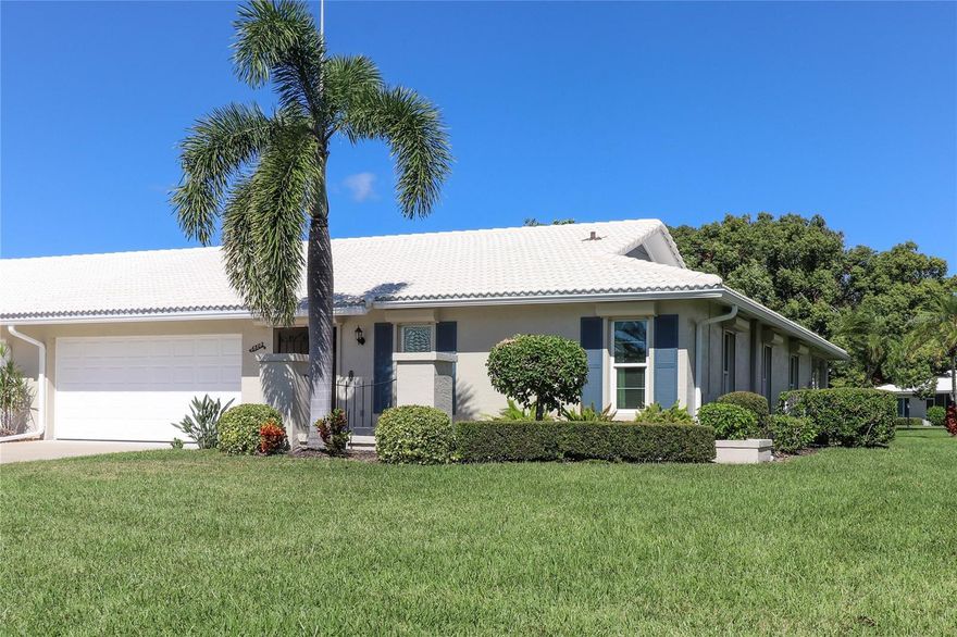 Enjoy the ultimate Florida lifestyle in this popular 55+ Village Green paired villa, ideally situated on a quiet cul-de-sac in West Bradenton—just 5.7 miles from the beautiful beaches of Anna Maria Island. This welcoming community is not in a flood zone, offering peace of mind along with a relaxed coastal vibe.
Step inside and discover 1,913 square feet of air-conditioned living space with an inviting glass-enclosed Florida room overlooking a tranquil greenbelt. The open, spacious floor plan features two oversized bedrooms with generous storage, a bright living and dining area, an eat-in kitchen, and a two-car garage. A charming wrought iron gate secures the front entry, adding both privacy and appeal.
Recent updates enhance the home’s comfort and style, including a new tile roof, updated windows, granite kitchen countertops, a stainless-steel double sink, and pull-out cabinet drawers. The kitchen also offers a large pantry with pull-out shelving. Both bathrooms have been tastefully renovated, and the home features fresh interior paint and new laminate flooring throughout—no carpet. Laundry is conveniently located just off the kitchen, and the unit comes equipped with a water system.
This land-owned property includes a $350 monthly condo fee (paid quarterly), covering basic cable TV, internet, exterior painting, annual roof cleaning, common area taxes, community amenities, escrow reserves, grounds maintenance, landscaping, exterior pest control, and pool upkeep. Centrally located, the villa offers quick access to shopping centers, medical facilities, a wide array of restaurants, G.T. Bray Park, Robinson Preserve, the Downtown Riverwalk, and the Gulf beaches. Nearby airports include Sarasota Bradenton, Tampa, and St. Pete. For your private showing, contact the listing agent today.