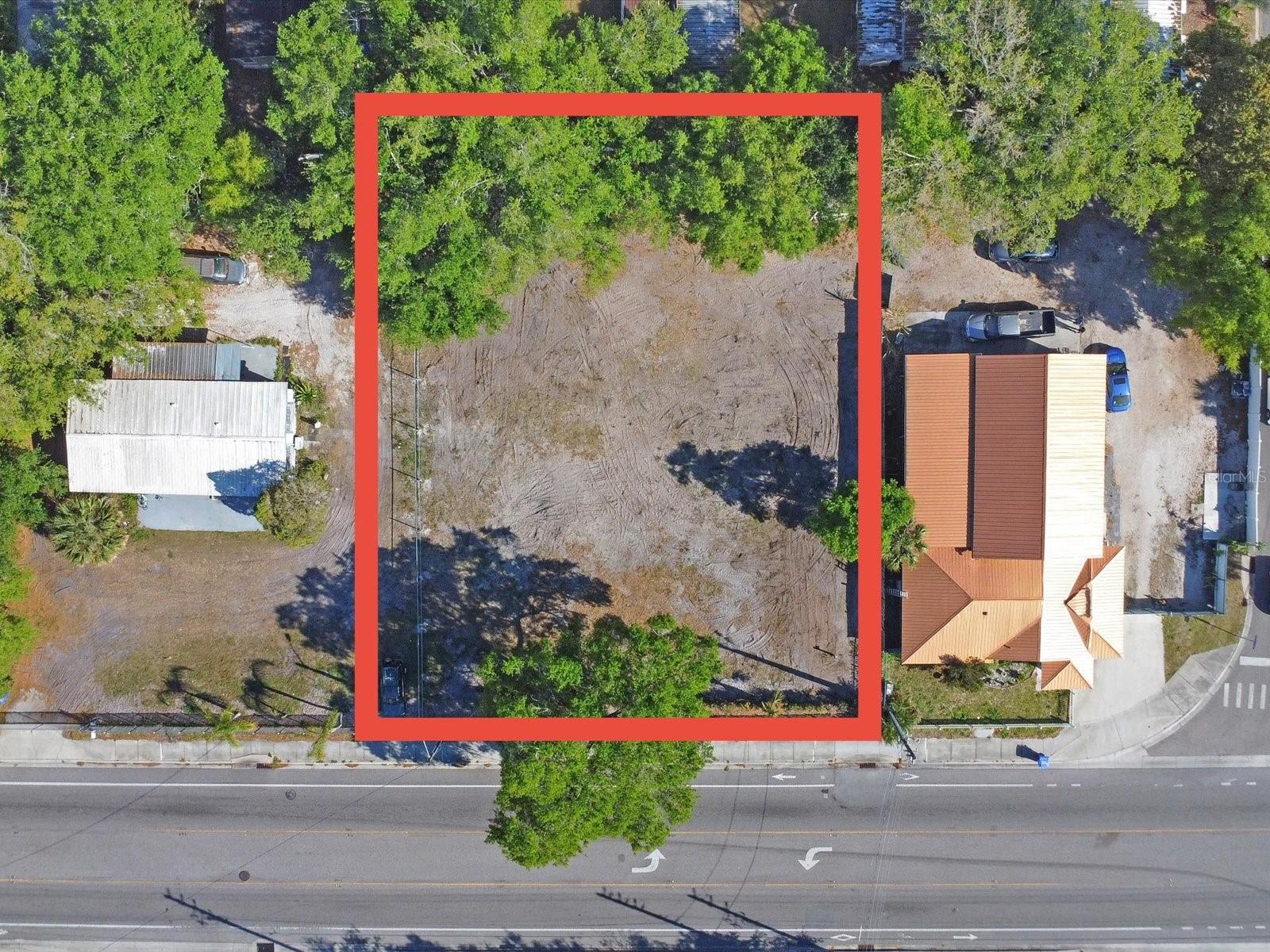 This commercial and residential lot is truly one of a kind! The lot has an electronically opened gated aluminum fence. The fence itself has a height of 6 ft and the gate itself opens 20 ft wide, perfect for all vehicles. Located on an active and busy street near all of Central Florida’s main roads, this is in the perfect location to do business. Already having water, electricity, and being cleaned start building your dream business today! There is so much potential here, build your dream single family or multi family home, duplex, triplex, townhome, office, and more! Check out these adjacent commercial listings that are also for sale! S5120800