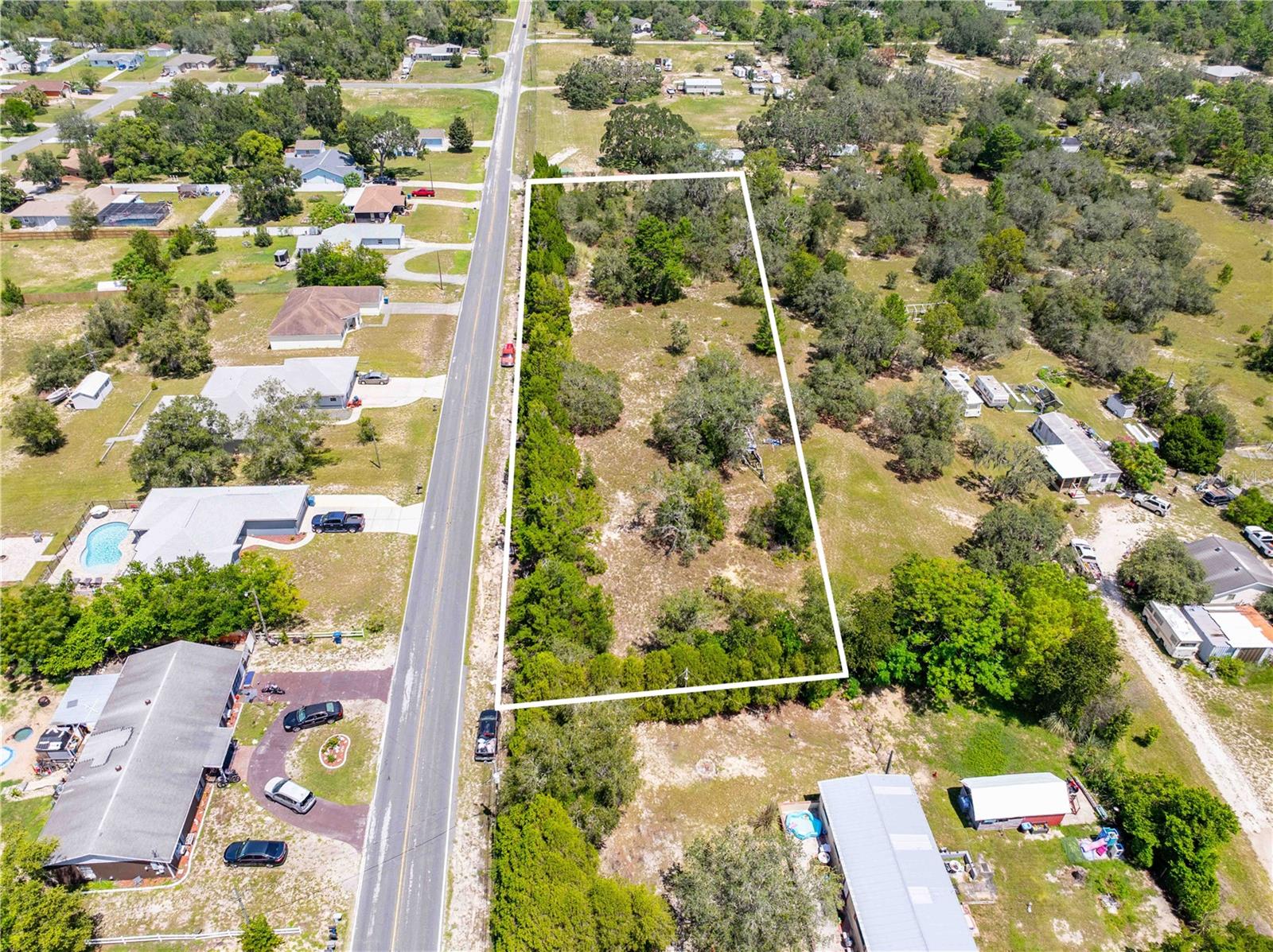 1.3 Acre Vacant Lot - Space, Convenience & Lifestyle This 1.3-acre lot with NO HOA gives you plenty of room to spread out and bring your vision to life, while still being close to all of the amenities you need. With ample space for outdoor living, hobbies, or future plans, the property offers endless possibilities and a lifestyle that blends comfort with convenience. Great location for commuters—both US 19 and the Suncoast Parkway are close by, offering a smooth drive to Tampa and surrounding areas. Schools are just 2.5 miles away, making daily routines simple. For those who love the outdoors, Weeki Wachee Springs State Park is nearby—perfect for kayaking, snorkeling, or fishing along with the Suncoast Trail for miles of biking or jogging. When you're ready for a beach day, Pine Island is only 12 miles away with white sand, Gulf waters, and boating opportunities. This is a rare opportunity to build your perfect home on a spacious lot that offers both versatility and easy access to everything the area has to offer.