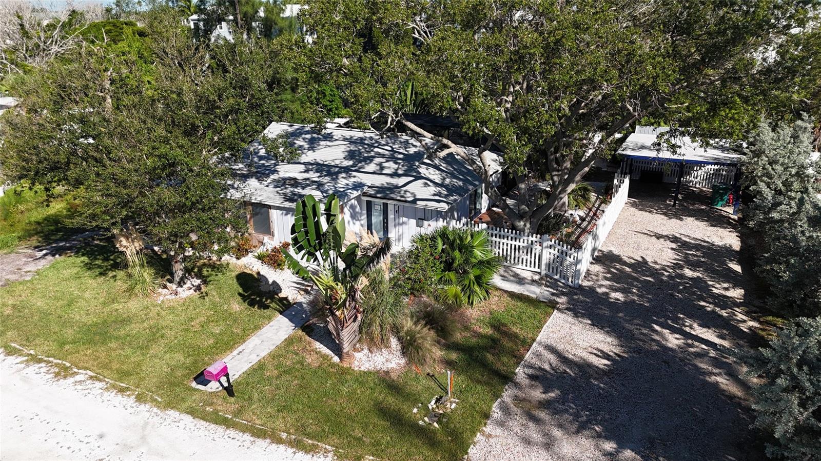 This sweet little spot on Longboat Key is one of the best deals you'll find anywhere. Forget the fuss—it's tucked away on a quiet, private, dead-end street with no HOA in a picturesque location on a stunning stretch of North-End Longboat Key. The best part? You can wiggle your toes in the sand in just a 4-minute (0.20 mile) barefoot stroll to the beach! This .28-acre piece of paradise is pure potential, whether you're someone dreaming of that perfect beach residence, a builder looking for a prime canvas, an investor ready for some easy money. Make it Your Own: You can either give the existing home some very easy love or scrape it clean and build the custom oasis . The location couldn't be more ideal for either direction you take. Ready to Splash? The value is already shining here, thanks to the brand-new, beautiful gunite saltwater pool and spa—a $120,000 upgrade! It's got a new hurricane-rated enclosure and filtration system, plus wrap-around stone pavers providing large deck space and walkways. That private, finished outdoor space is waiting for you to jump right in and can be the centerpiece of any renovation or future build. Bay Access Bonus: Even better, you get deeded access to the Sarasota Bay via private boat launch at the end of Ed Lee Lane. You and 4 neighbors share this deeded access and it is a true island amenity. That's true island living—beach and bay at your fingertips. On top of all this the location of this home offers effortless access to an array of island amenities, boasting a very high walkability rating for Longboat Key. Easy access to the scenic 34 acre Joan Durante Park, providing a serene retreat for outdoor enthusiasts. A diverse selection of nearby restaurants and bars, ranging from charming delis and lively sports bars to fine dining establishments, are conveniently located right outside your door. Most notably very close beach access (0.20 mile) provides direct entry to one of the most spectacular beaches in the state. Recent improvements beyond the Pool/Spa are 2019 Roof, 2018 AC, 2019 Ductwork, 2024 storage shed ready for electric, full property fencing, landscape, hardscape and irrigation, The sellers are motivated to let this go, so they've priced it to move, favoring cash buyers for a smooth, quick close. Don't let this slice of Longboat Key slip away!