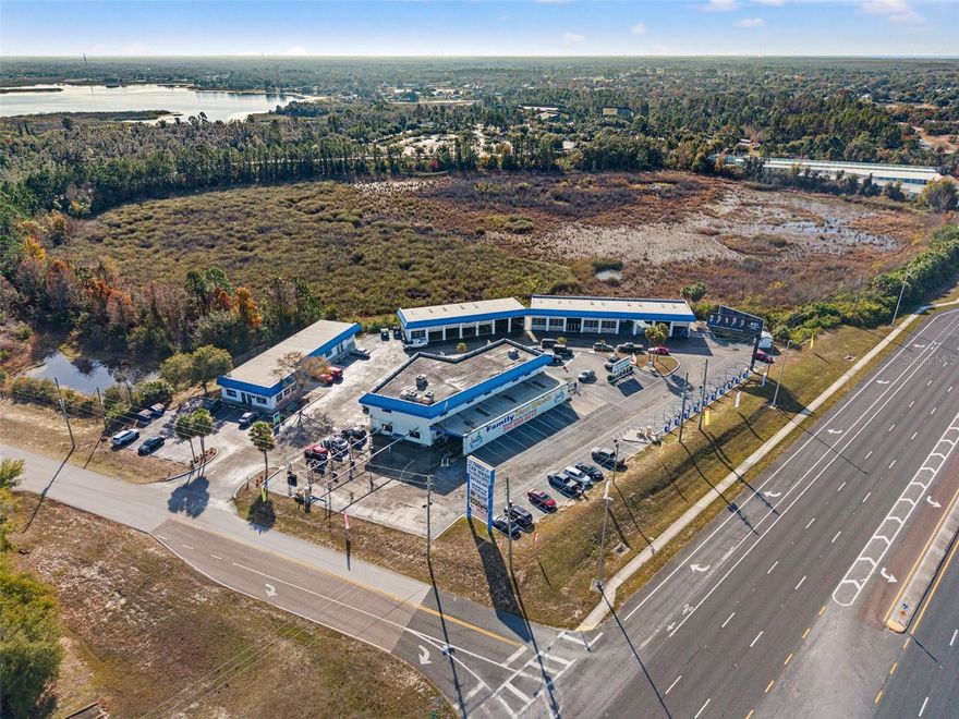 Exceptional Opportunity: Full-Service Premium Car Wash and Detail Center with Additional Income-Producing Commercial Buildings.
Rare opportunity to acquire a high-visibility, full-service premium car care and detail center situated on 2.6± MOL acres on a prime corner lot with 45,000+ AADT and dual north and south lane access from US-19 / Commercial Way. This irreplaceable location delivers outstanding exposure, easy ingress/egress, and consistent traffic flow.
The established business is a full spectrum car wash offering express washes, full-service interior and exterior cleaning by trained staff, premium professional detailing, window tinting, and ceramic coating - all in one convenient location. Turnkey with fully staffed operation with management in place, allowing for a seamless transition for new ownership.
The main building features an impressive 2,000+ SF customer lobby and a 110-foot wash tunnel, equipped with rebuilt equipment and an upgraded ICS system completed in 2016. The detail center includes 2 attached dedicated garage bays on the main building, as well as 4 additional garage bays on adjacent building. In addition, the 2nd story of the main building boasts 4,500 SF of climate-controlled space, ideal for expansion, additional services, or supplemental rental income. The opportunities are endless!
Further enhancing the investment appeal, the property includes three additional buildings with existing tenants, creating multiple income streams and positioning this asset as a true business powerhouse.
This one-of-a-kind property offers significant upside potential through service expansion, increased throughput, added tenants, or redevelopment. Ideal for owner-operators, investors, or portfolio expansion seeking a high-traffic, income-producing commercial asset in a rapidly growing corridor.
