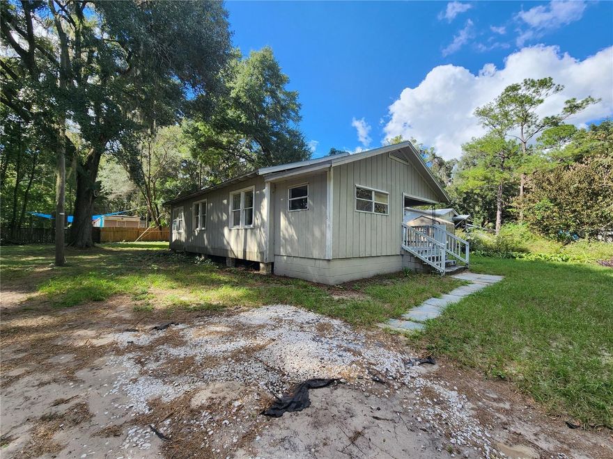 Sweet 2 bedroom, 1 bath home with office space. Built in 1960 with 915 sq. ft. Central heat & air, updated bathroom, wood floors, well/septic, large, unfenced yard. Washer dryer connections. Back porch.  Limited to three occupants.