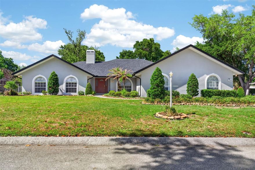 Discover this exceptional four bedroom, two and a half bathroom single family home crafted by award winning Lakeland custom builder Ernie White. This residence is located in the quiet secluded neighborhood Lakeland Highlands and features a unique floorplan, high ceilings, and a cozy wood burning fireplace in the living room. Water resistant vinyl flooring was installed in 2020. Hallways are equipped with dimmer lights for ambiance. All window blinds were replaced in 2022. 

The large primary bedroom boasts tray ceilings, a generous walk in closet, and direct access to the patio. The kitchen is a chef's dream with stainless steel appliances, including a double oven with regular and convection settings, ample cabinet space, and expansive counters. A convenient pass through window connects the kitchen to patio, highlighted by a new kitchen faucet. All bathrooms feature new toilets, with the third bathroom offering direct patio access.

Entertain effortlessly on the large screened in patio, complete with a ceiling fan, accessed through elegant French doors. The fully fenced backyard provides privacy and includes a gate. This home is situated on an oversized lot and includes an oversized two car garage with shelving, ready for an emergency generator. There are three attic access points and plywood sheeting for additional storage. The septic tank was recently serviced. An aluminum attic ladder offers easy access. An irrigation system keeps both the front and backyard vibrant.

Benefit from recent upgrades including a roof replaced in 2019, specialized 8x10 fascia board, a Lennox Signature Collection High Efficiency 4 ton AC from 2016, and an updated water heater from 2011. The exterior was repainted in 2019, and the interior refreshed in 2022. Enjoy the freedom of no HOA and proximity to major highways Polk Pkwy, SR 60, SR 98, US 17 and I-4, grocery stores, restaurants, and so much more. Schedule your showing today!!