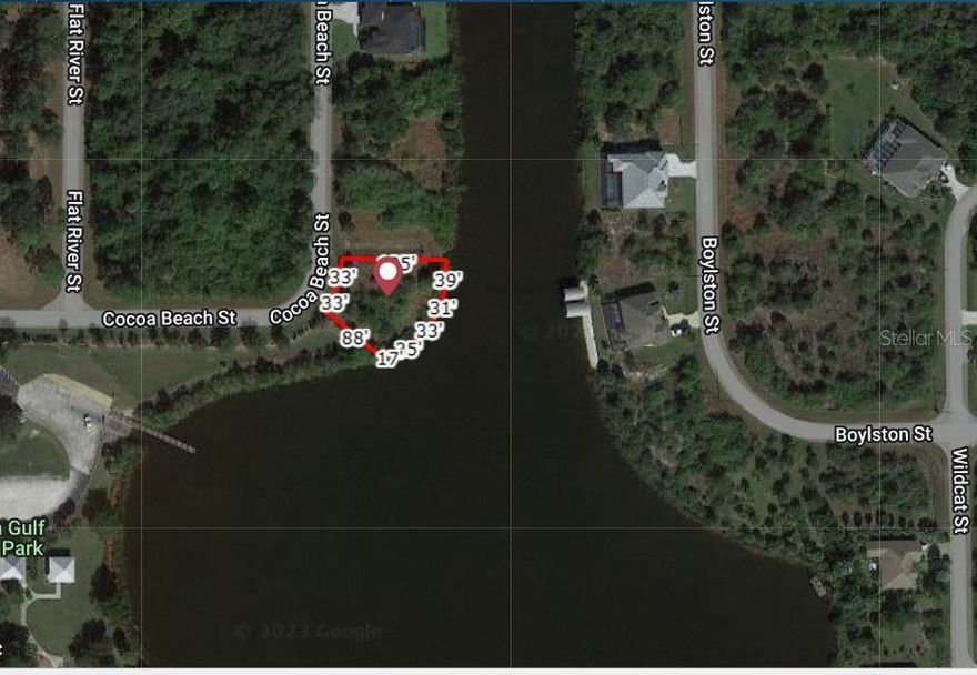 BIG VIEW!  GULF OF MEXICO ACCESS WATERFRONT OVERSIZED  BUILDING LOT.  LOCATED IN GROWING SOUTH GULF COVE. Next to a Park with a boat ramp. Southern route has only 1 Bridge access to the lock. Public water and sewer. Nine golf courses and world class Gulf of Mexico beaches at Boca Grande within a 15-minute drive.