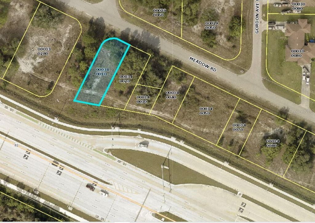 Photo of 1100 Meadow Road, Lehigh Acres, FL 33973 (MLS # C7525662)