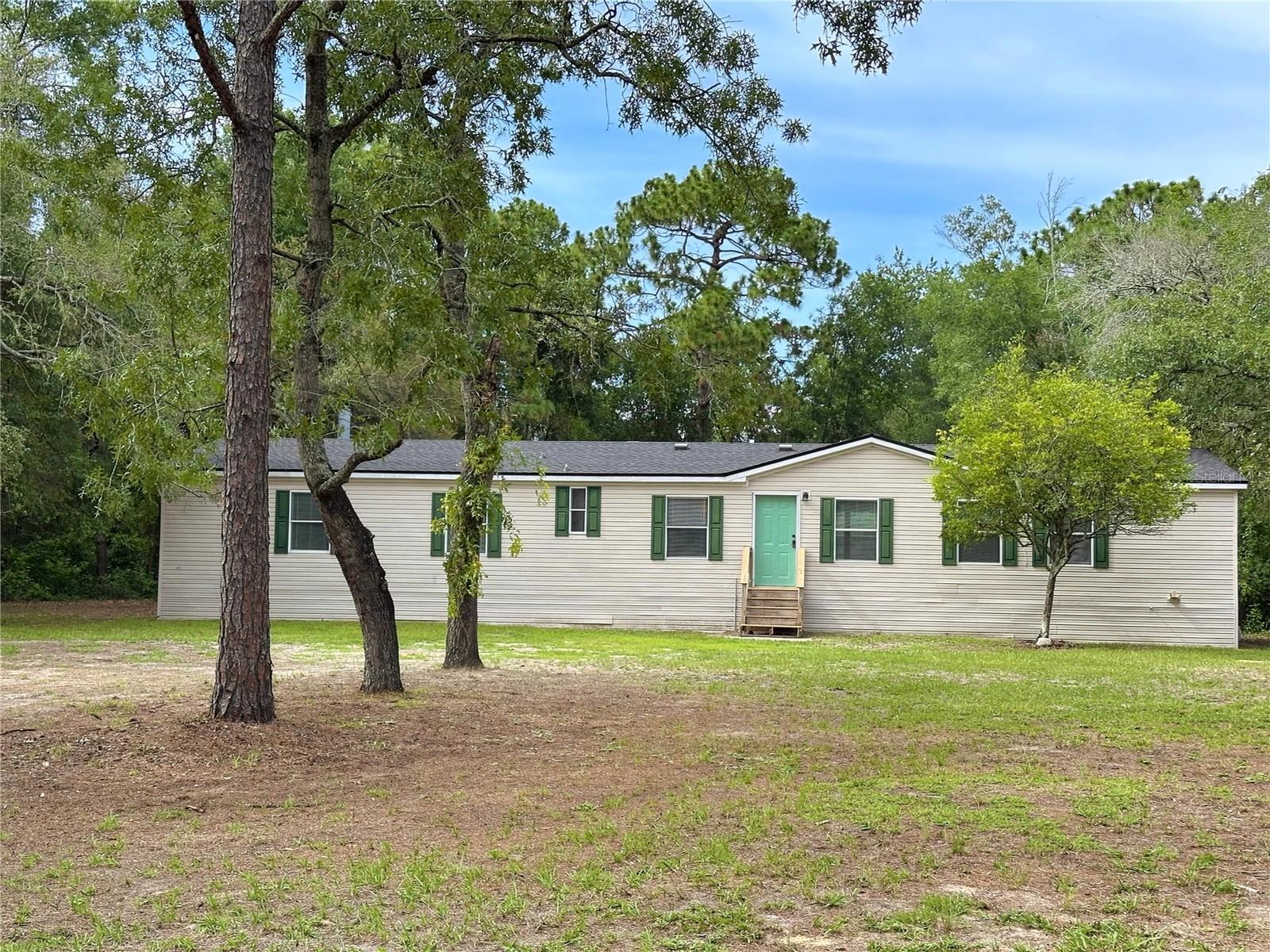 Move-in ready 4 bedroom, 3 bath home on a shaded 1.2 acre lot is waiting for a new owner. The kitchen and baths have NEW granite counters, cabinets, fixtures and lighting. The newer kitchen stainless appliances are the cherry on top. Easy care Luxury Vinyl Plank flooring throughout compliments the fresh neutral color palette. Enjoy the spacious backyard with ample room for your 'extras' think RV, Boat, or outdoor kitchen. Bring it all!