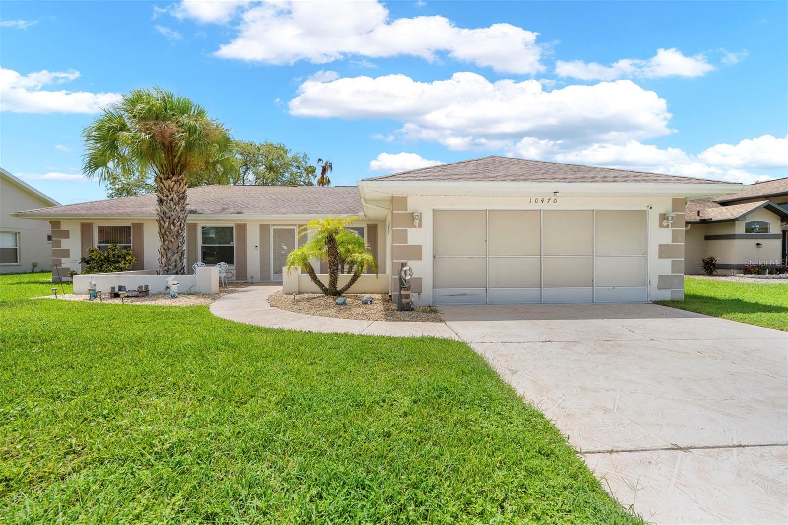 Turn-Key Freshly Updated Pool Home in the Beautiful Community of Seven Hills – 2 Bedrooms, 2 Baths
Walk through the front door and you’re greeted by vaulted ceilings and immediate views of the pool through sliding glass doors—a resort-like scene that brings peace and relaxation right to your very own backyard. This beautifully freshly updated, turn-key 1,632 sq. ft. residence is designed for comfort and style. Featuring a spacious split floor plan with modern vinyl flooring throughout, this home combines everyday functionality with warm, open living spaces. Featuring an open concept living space with eat-in kitchen and an offset dining area that may possibly be converted into a 3rd bedroom, this home offers endless possibilities!
The light-filled living room flows seamlessly to the screened lanai and sparkling heated pool—with a new pool heater installed in 2024—creating the perfect indoor-outdoor lifestyle. The kitchen connects easily to the dining and living areas, making it ideal for entertaining family and friends.
The primary suite provides a private retreat with dual sinks and a walk-in shower with sliding glass doors. The guest bath includes a convenient tub/shower combo, and the inside laundry room adds to the home’s functionality. A 2-car garage ensures ample storage and parking.
Adding to the value, this home is being sold fully furnished, allowing you to move right in and immediately enjoy the Florida lifestyle.
Located in the beautiful community of Seven Hills, this home is just minutes from Florida’s Suncoast Parkway (589) and major shopping destinations including Publix, Target, Kohl’s, Winn-Dixie, and Walmart. You’ll also be just a few miles from Home Depot and Lowe’s, plus close to Florida’s natural springs, top-rated hospitals, dining, and more.
This property truly offers comfort, convenience, and location—everything you need for the perfect Florida living experience.