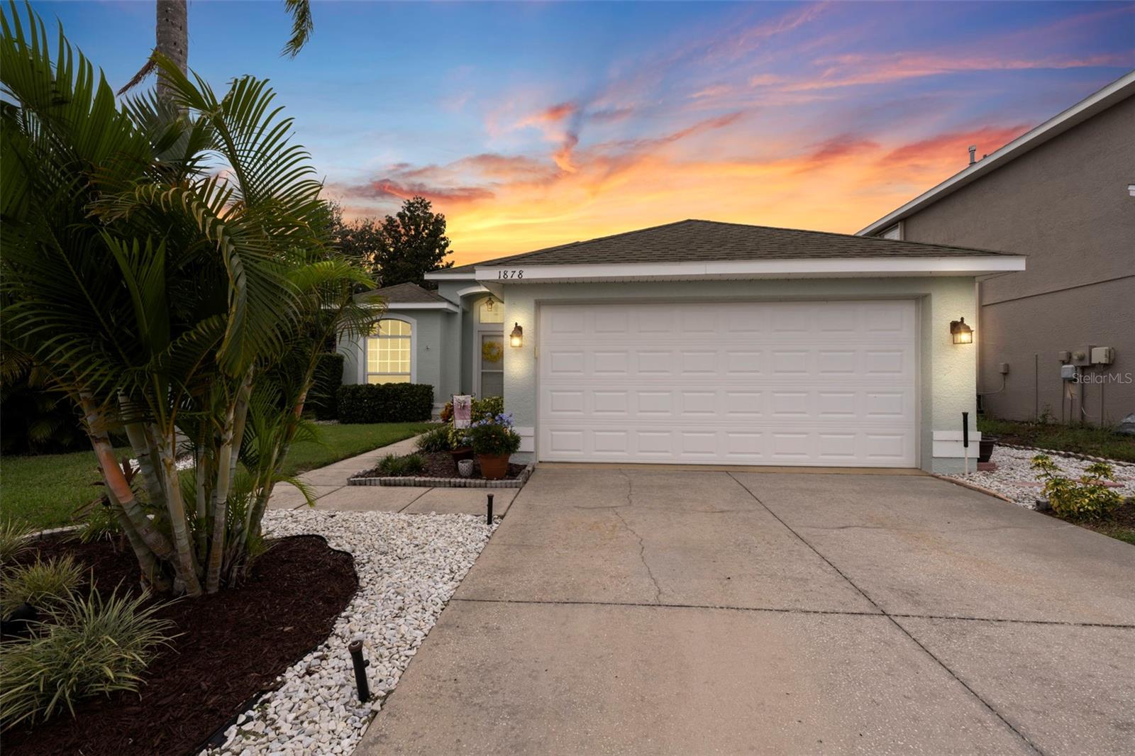 Welcome to 1878 Briland St, a lovingly cared-for 3-bedroom, 2-bath pool home with a flexible bonus room, peacefully nestled on a private cul-de-sac in the friendly Grassy Pointe community of Tarpon Springs. Wrapped in charming vinyl fencing for privacy and peace of mind, this home welcomes you with tall ceilings throughout, fresh paint, and a warm, airy feel the moment you step inside. The spacious master suite and bonus room both feature brand-new windows, filling each space with cheerful natural light, while the master and guest bathrooms have been thoughtfully remodeled for comfort and style. A two-car garage adds everyday convenience, and a new state-of-the-art AC system with a smart Nest thermostat keeps the whole house cozy year-round. The kitchen shines with stainless steel appliances and granite countertops, flowing easily into the living areas, perfect for casual family meals or relaxed entertaining. Outside, your own backyard retreat awaits with a sparkling pool surrounded by a paver deck, a cozy firepit, and low-maintenance zero-scaped landscaping—an ideal spot for barbecues, late-night conversations, and making memories. Every corner has been lovingly updated and maintained, creating a true move-in-ready home. All of this comes with the comfort of no flood zone, a welcoming neighborhood playground, great school zoning, and a location just minutes from Sunset Beach, Fred Howard Park, the famous Sponge Docks, and the shops and dining of downtown Tarpon Springs.