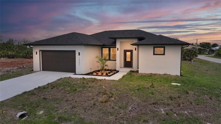 Rare opportunity for a new home to in South Gulf Cove with an adjacent lot included with this great deal.
A newly built 3-bed/2-bath contemporary waterfront home in South Gulf Cove. Situated on an oversized double corner lot overlooking a canal, this just-completed contemporary home offers more than 1,900 sqft of living space under air, a two-car garage, and thoughtful upgrades throughout.

Enjoy Florida living at its best with an outdoor kitchen featuring an outdoor refrigerator, sink, and grill, plus a cleared adjacent 0.24-acre waterfront lot ready for a dock, boat lift, or a detached garage.
Inside, an open-concept layout showcases modern contemporary lighting and stone-quartz countertops both in the kitchen and baths. The kitchen is designed with a large center island and high-end finishes. Separate from the kitchen, this layout includes a dedicated laundry room equipped with a full-size washer and dryer, and wall-mounted storage cabinets.
Ceiling fans are featured in every room alongside custom closet shelving. The primary suite features a spa-like rain shower, a soaking tub, and a massive custom walk-in closet featuring a convenient center island, making it feel like your personal spa.

Exterior features such as durable impact-rated doors and windows, a whole-house exterior water filter, and construction built one foot above the floodplain standard deliver true peace of mind. Deluxe exterior lighting adds curb appeal after dark. Outside, enjoy your canal water view.
The epoxy-coated garage floor and ceiling-track storage make the most of your parking space, which also includes a built-in electric car charging station.

South Gulf Cove is a true waterfront community with an extensive network of 55 miles of navigable man-made canals that link directly to Charlotte Harbor and the Gulf of Mexico, making this area ideal for boating enthusiasts. Residents benefit from a yacht club, a community park, and a residents' boat ramp. Outdoor lovers will appreciate easy access to boating, fishing, swimming, and shelling in nearby Placida and Englewood, along with golf courses and world-class tarpon fishing in Boca Grande.

This home delivers a rare blend of new construction, modern amenities, and a waterfront lifestyle in one of Port Charlotte’s most sought-after neighborhoods. Schedule your tour today!