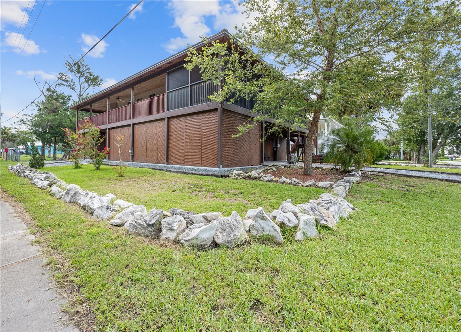 Beautiful 2/2 located on a canal in Crystal River Florida! Both bedrooms are master suites! Living area is upstairs and garage/storage/workshop space is below. Home has two garage entrances and two staircases leading up to the living area upstairs. If you don't want to use the stairs, there is also an elevator/lift from the garage to upstairs! Enjoy the wrap-around porch with two screened in areas! Watch local wildlife from the porch or sit down by the dock and watch for manatees! Dock is complete with a covered boat lift as well! Too many things about this one to list!