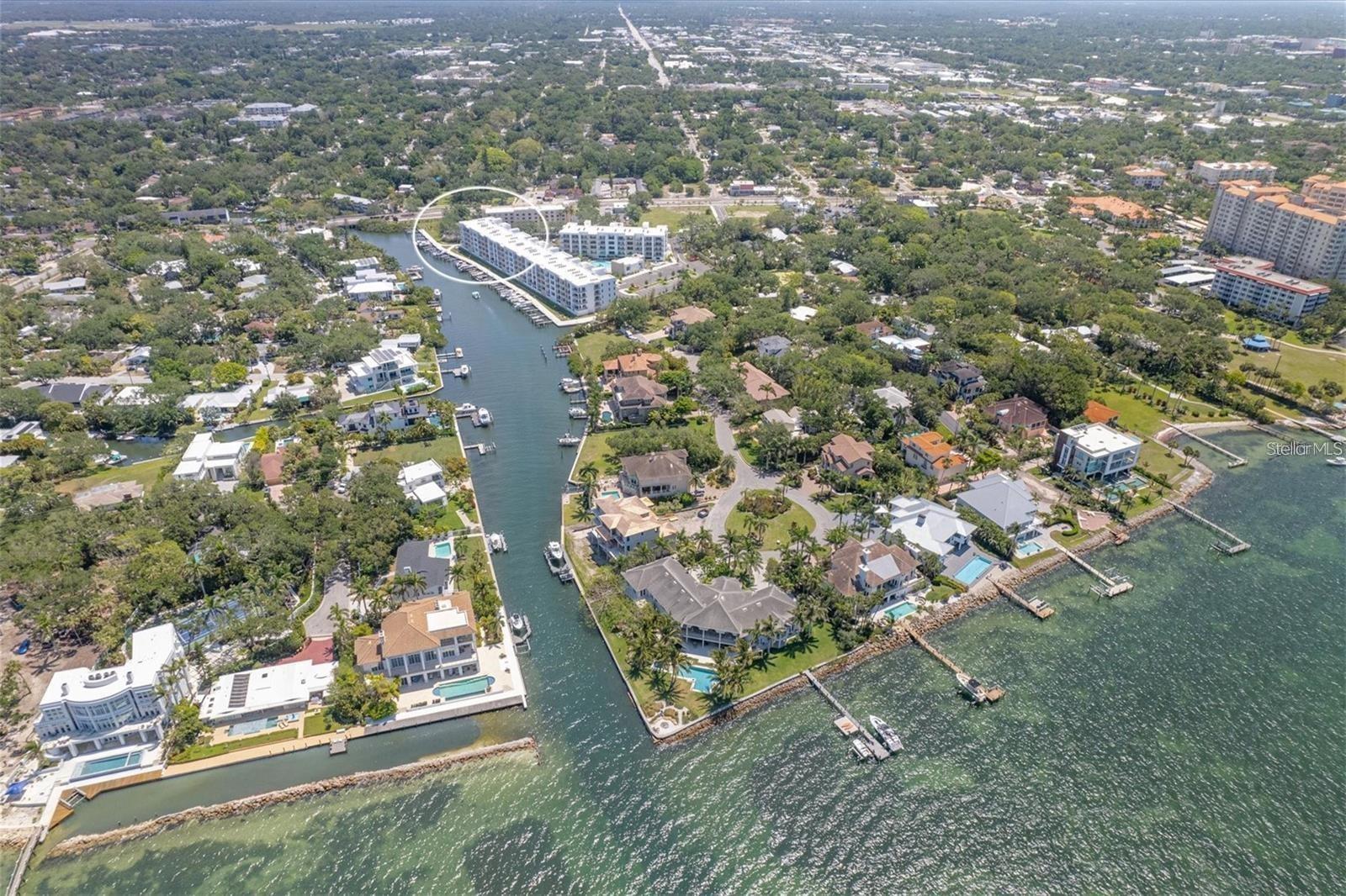 OPTIONAL: Deeded Boat Slip and New 13,000 lb. lift July/2022 #31 available at extra cost of$140,000.
MUST SEE PENTHOUSE AT THE STRAND, WEST OF TRAIL, NEW IN 2022 & IN A GATED COMMUNITY. ON-SITE MANAGEMENT AND MAINTENANCE. PRIME LOCATION ONLY ONE MILE TO DOWNTOWN SARASOTA, PALM AVENUE FOR SHOPPING, RESTAURANTS AND THE ART CULTURE/THEATRES. 15 MINUTES TO BEAUTIFUL ST. ARMAND'S AND LIDO KEY BEACH. 5 MINUTES TO SRQ AIRPORT AND 15 MINUTES TO FAMOUS UTC MALL. OPEN FLOOR PLAN MAKES THE UNIT SPACIOUS AND COMFORTABLE. THE MASTER BEDROOM HAS AN ENSUITE BATH WITH LAUNDRY ROOM ANS UPGRADED SAMSUNG FULL SIZE WASHER/DRYER. BEAUTIFUL WALK-IN SHOWER AND VANITY WITH DUAL SINKS. WALK IN CLOSET FOR YOUR PERSONAL BEACH WEAR. THE DEN CAN FIT A QUEEN BED FOR A SECOND BEDROOM PERFECT FOR YOUR FRIENDS AND FAMILY TO VISIT AND 2ND FULL BATH W SHOWER/TUB UPGRADED VANITY AND TILE SURROUND. THE KITCHEN FEATURES A REVERSE OSMOSIS FILTER WATER FAUCET AND HARD SURFACE COUNTERS, NEW SPEACIAL UPGRADES OF DINING ROOM IGHT, CEILING FAN AND HALLWAY LIGHTS. STAINLESS STEEL APPLIANCES UPGRADED CUSTOM REFRIGERATOR AND A LARGE ISLAND FOR ENTERTAINING AND ANOTHER WRAP AROUND COUNTER FOR YOUR CHEF'S DINNER. 9 FT HIGH CEILING AND SLIDERS MAKE THIS UNIT BRIGHT WITH NATURAL LIGHT. GORGEOUS VIEWS & SUNSETS FROM THE BALCONY. RELAX AND ENJOY THE BOATS, BIRDS, FISH, & DOLPHINS/MANATEES. SIT ON THE DOCK AS IT'S A FISHERMANS DELIGHT. DIRECT WATER FRONTAGE ON WHITAKER BAYOU AND DIRECT ACCESS TO SARASOTA BAY AND INTRACOASTAL WATERWAY. THE AMENITES ARE ENDLESS WITH THE AMAZING HEATED POOL/SPA, GRILLING CENTER AND TOP OF THE LINE FITNESS CENTER. DEEDED GARAGE PARKING SPACE UNDER BUILDING WITH PLENTY OF OPEN GUEST PARKING. WATERFRONT WALKING PATH, FLOATING KAYAK AND PADDLE BOARD DOCK. PET FRIENDLY WITH A FENCED-IN DOG PARK. GREAT RENTAL OPPORTUNITY WITH ONLY A MINIMUM OF 7 DAYS. WHERE IN SARASOTA, ON THE WATER, CAN YOU FIND ALL THIS FOR $599,000 AND DEEDED BOAT DOCK AND SLIP @$140,000. ? RESIDENTS ARE WARM AND FRIENDLY AND THE INDIAN BEACH SAPPHIRE SHORES, ACROSS THE WATER, IS A GREAT WALKING NEIGHBORHOOD FOR MORNING AND EVENING STROLLS.
