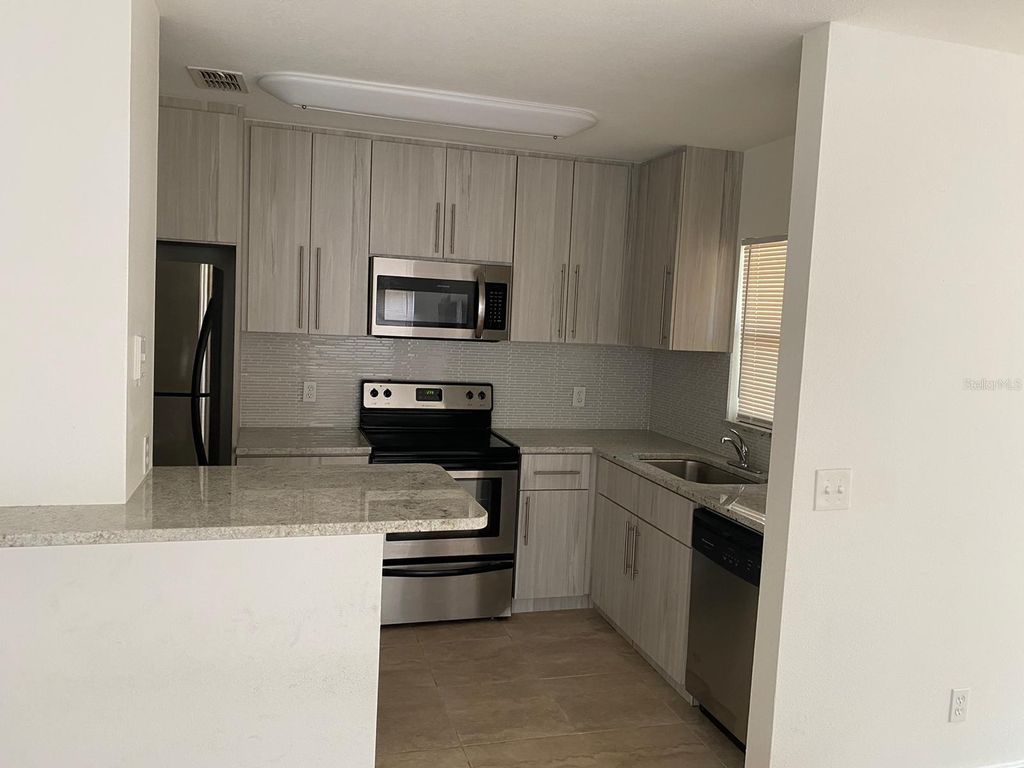 Photo of 5452 E Michigan Street #5452-1, Orlando, FL 32812 (MLS # O6404403)