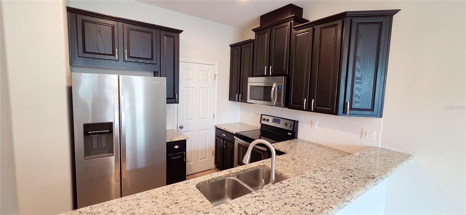 Beautifully updated 3BR/2.5BA townhome in excellent condition. Home features brand new engineered hardwood flooring throughout both levels, fresh interior paint, and refinished kitchen cabinets. The main level offers an open living and dining area, modern kitchen with walk-in pantry, and half bath. Upstairs includes a large master suite with built-in walk-in closet , dual-sink bath with modern shower, plus two additional bedrooms, a full bath, and laundry with washer/dryer in-unit. Two-car garage with ample guest parking. Internet included in rent. 12+ month lease required. No pets, no smoking. Tenant responsible for AC filter replacement and dryer vent cleaning.