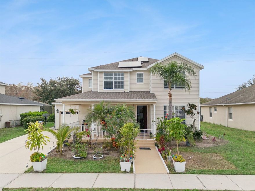 Welcome to this spacious and inviting 5-bedroom, 4.5-bathroom home located in the desirable community of Trafalgar Village. A charming covered front porch sets the tone—perfect for relaxing and enjoying the Florida lifestyle.

Step inside to a thoughtfully designed open living area that flows seamlessly into the family room and kitchen, creating an ideal space for everyday living and entertaining. The kitchen features stone countertops, stainless steel appliances, and a center island with additional seating, making it the heart of the home.

The first floor offers exceptional convenience with a guest bedroom, a full bathroom, an additional half bath, and a dedicated laundry room. Upstairs, you’ll find two spacious primary suites, each with an attached bathroom featuring garden tubs and separate showers. Across the hallway are two additional guest bedrooms and a full bathroom with a tub/shower combination.

Sliding glass doors from the family room lead to a covered lanai overlooking the screened-in pool and spa, perfect for relaxing or entertaining year-round. Additional highlights include solar panels and a new roof installed in 2023, adding value and peace of mind.

Trafalgar Village offers easy access to theme parks, shopping centers, dining, and entertainment, with Disney World, Orlando International Airport, and major shopping destinations just a short drive away. This home blends space, comfort, and location—schedule your private showing today and experience all it has to offer.