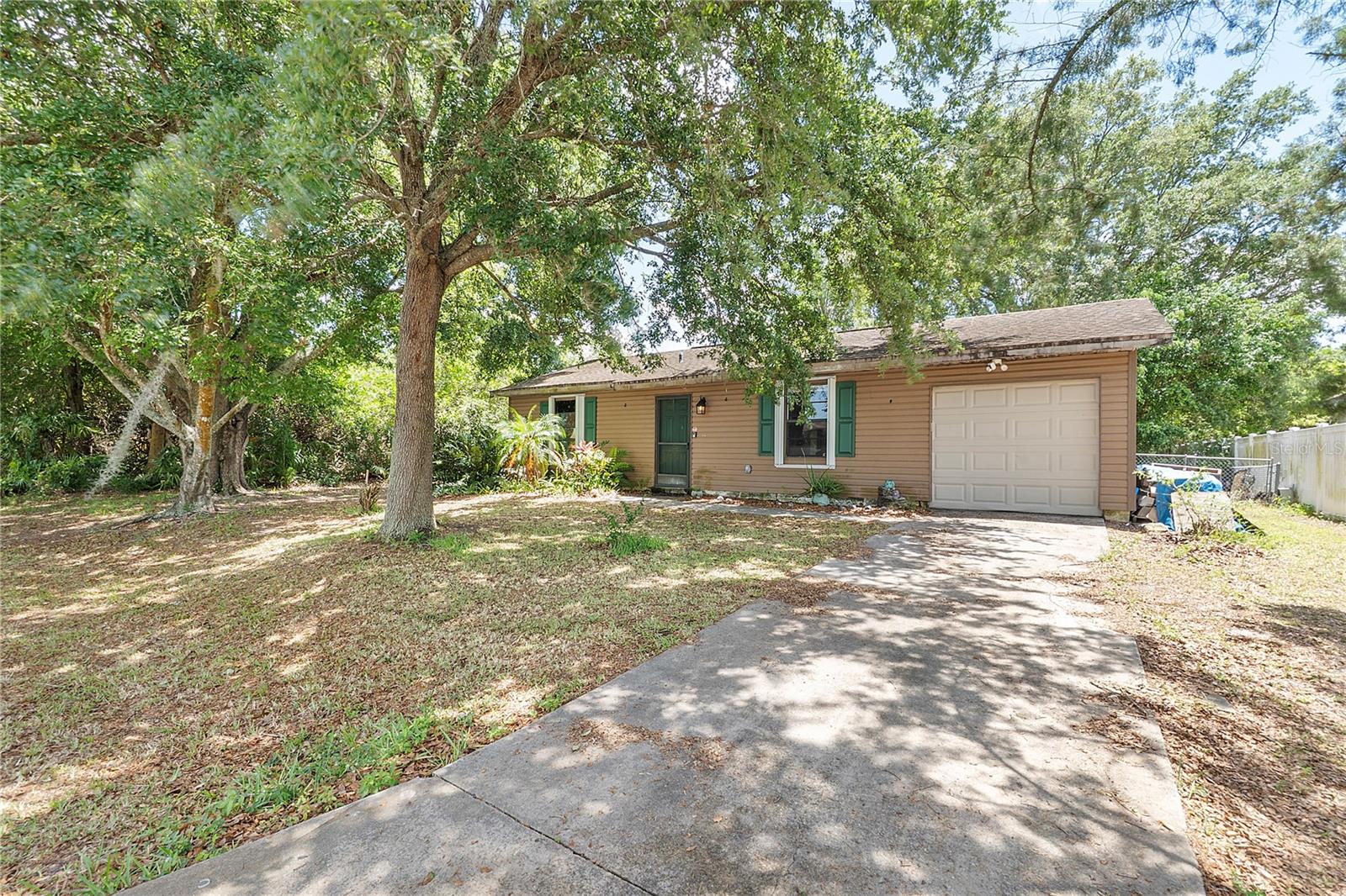 Charming Home in Great Location! This cozy 2-bedroom, 1-bath home is the perfect fit for first-time buyers or those looking to downsize in comfort. Nestled in a quiet, well-kept neighborhood, you’ll enjoy the convenience of being just minutes from major shopping centers, Interstate 95, and only 20 minutes from the beach! Sitting on a spacious lot with .24 ACRES and chain-link fenced yard, this home has been thoughtfully updated with a brand new septic system, hurricane shutters, water heater, A/C unit, water filtration system, and electric box—all the essentials for peace of mind and easy living.
Step outside to relax or entertain on the large patio or unwind in the enclosed screen porch. Whether you're gardening, grilling, or enjoying Florida’s beautiful weather, this yard has plenty of space to make it your own. Don’t miss your chance to own this move-in ready gem,
Schedule your showing appointment today!