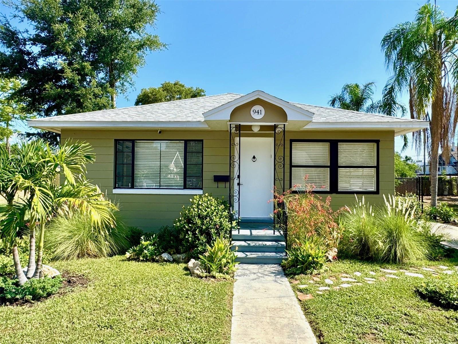 Near where Booker Creek flows into Roser Park is a quiet neighborhood with quirky old homes and big trees called Campbell Park. 941 8th Ave S is lovingly maintained on a brick street just eight blocks south of St. Pete's Central Ave. Built in 1951 from concrete block, much of the home's original charm remains with oak flooring, some original doors, arched entryways and metal awnings. Over the last few years however, the home has enjoyed several updates: a new kithchen and bath, landscaping, fresh paint, lighting, fixtures and hardware. The kitchen appliances are also new, as is the fancy LG stacked washer and dryer. The home has a clever layout and ample space in every room, separate dining/office space, large eat-in kitchen, many kinds of flowering plants and palms, generous storage, a fully fenced backyard and enough driveway space for two or more cars. This is a well cared for home in a great location. Available for showings beginning Friday, August 1st. First month's rent and one month's securtity deposit are required. Well qualified applicants only, please!