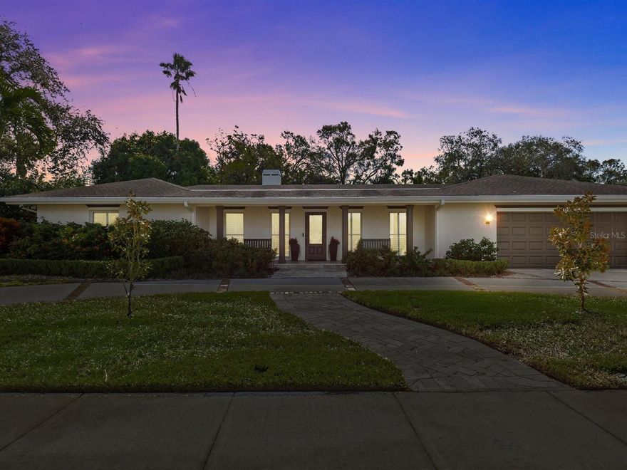 **UNDER CONTRACT- TAKING BACK UPS**Welcome to this gracious, executive-style pool home in beautiful Belleair! You’ll love the spacious living areas, all oriented toward the gorgeous outdoor areas allowing for ease of living and great entertainment, and room for everyone. The living spaces are accented with elegant trim, offering an elevated aesthetic, and the split floor plan with four bedrooms, three bathrooms, and a separate office is ideally designed for both privacy and togetherness. The kitchen is the heart of this home and offers solid wood cabinetry, stone countertops, built-in ovens, and a walk-in pantry; the utility room is conveniently located nearby for extra storage and convenience.  Luxurious details punctuate the extra-spacious primary suite, including a spa-like bathroom with stone finishes, freestanding tub, separate shower, custom double vanity, and large walk in closet. There is another en-suite  bedroom + two additional bedrooms and an additional bath, all with elegant marble finishes and generously sized. A dedicated office allows privacy for working from home.  Enjoy the best of the Florida lifestyle with indoor/outdoor living! Spend afternoons splashing in the pool and entertaining with the fully integrated outdoor kitchen and tv areas- perfectly designed to maximize enjoyment!  Technical details include a whole-house generator, upgraded windows and doors, fully integrated irrigation system, EV charger, and Control 4 Smart Home system which allows control of all systems via app- a $150,000 upgrade!  Located in a high and dry flood zone X with quick access to the beaches, dining, airport, The Pelican, Belleair Country Club,  and the countless amenities of the Town of Belleair….the perfect place to call ‘home!’