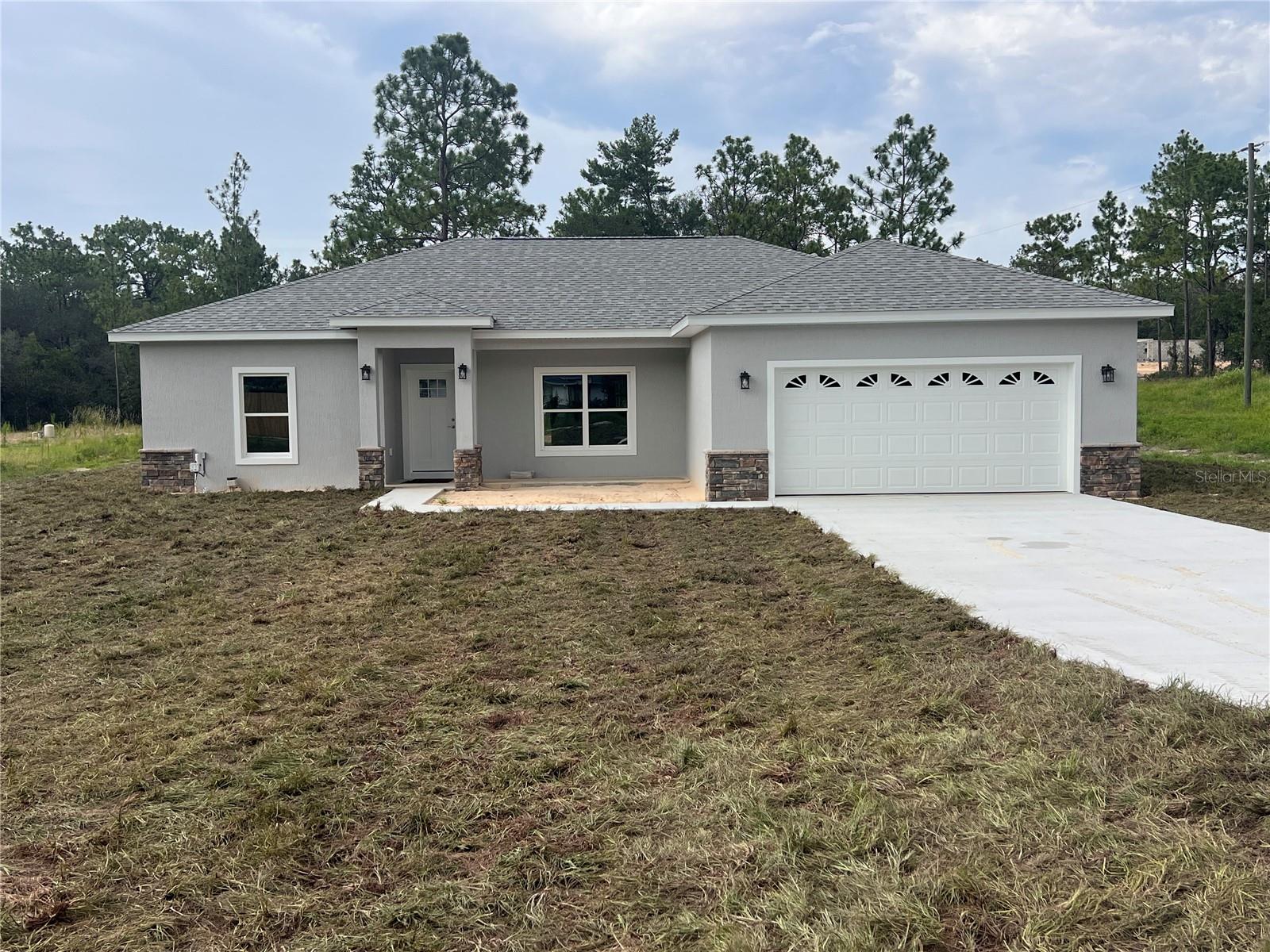 Under Construction. Brand new 3/2 on .99 acre corner lot in Rolling Hills. Features, luxury vinyl plank flooring throughout except bathrooms which are tile. Split bedroom plan, open floor plan in kitchen, dining, living area with high ceilings. Large pantry, stainless steel appliances, granite countertops, kitchen with eat at bar. Master bedroom with walk in closet and tray ceiling. Master bathroom has double vanities, walk in shower and linen closet. Inside laundry room. Front and rear covered porches.