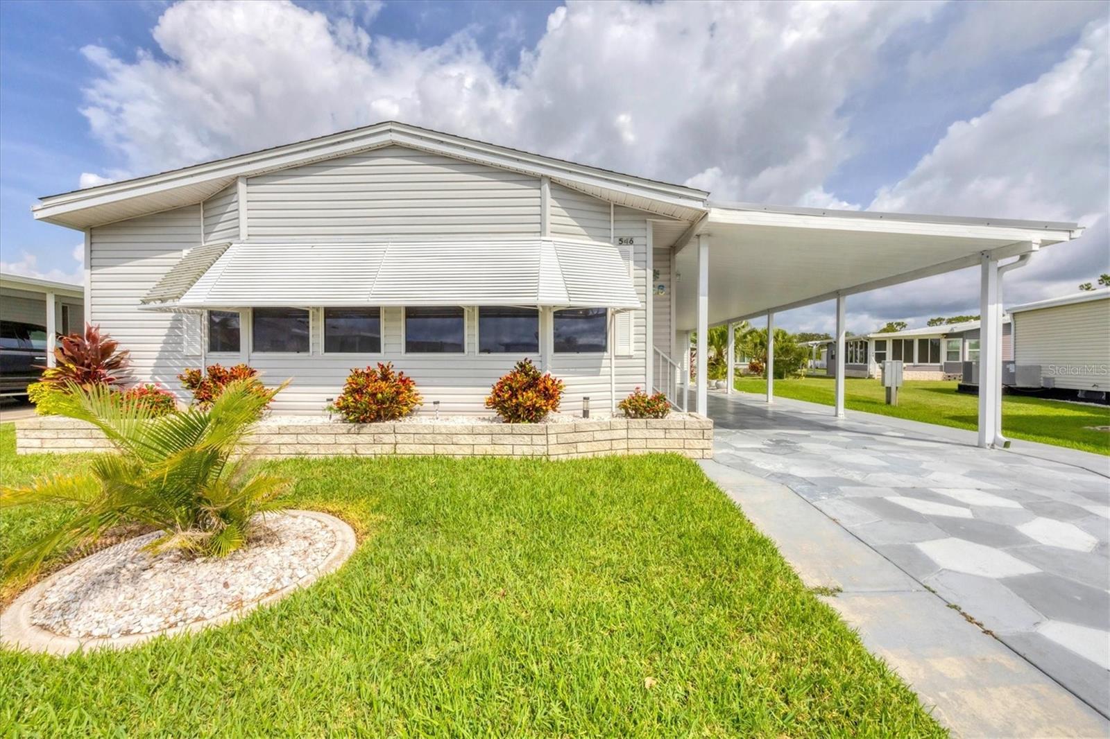 *Buyer financing fell through so you get a second chance at this incredible opportunity!* Welcome to 546 Amberjack Drive, a beautifully updated double-wide manufactured home in the vibrant 55+ gated community of Harbor Isles. From the moment you step inside, you’ll feel the warmth and charm of this open-concept interior, featuring an inviting living and dining area that flows seamlessly into a spacious family room — perfect for entertaining or relaxing.
The bright, updated kitchen offers ample cabinetry, a cozy breakfast nook, and a functional layout that makes daily living a breeze. Toward the back of the home, the generous guest bedroom includes a large walk-in closet and is conveniently located next to a full guest bathroom. The interior laundry room also doubles as a versatile office or creative space.
The primary suite is a true retreat — expansive and private, with another oversized walk-in closet, a second closet for extra storage, and a large ensuite bath. The entire home is filled with natural light thanks to the multiple skylights! Outside, you'll find a recently redone carport cover and spacious 12x12 shed attached - perfect for tools, hobbies, or extra storage.
Harbor Isles is one of the area’s premier land-owned communities, offering resort-style amenities and a true sense of community. Residents enjoy a heated pool and spa, clubhouse, fitness center with sauna and locker rooms, tennis and pickleball courts, shuffleboard, bocce, and more. The active clubhouse features a full social calendar, hobby rooms, and an event center. Outdoor lovers will appreciate the pavilion by the water, marina with boat slips, kayak/canoe launch and storage, fishing pier, and scenic walking and biking paths.
Harbor Isles is golf-cart friendly, pet-friendly, and perfectly located—just minutes to the new Downtown Wellen Park, world-famous Gulf beaches, ample shopping, top-rated medical facilities, restaurants, and the spring training stadiums for both the Braves and the Rays.
Don’t miss this incredible opportunity to live the Florida lifestyle you’ve been dreaming of — with comfort, community, and convenience all in one place. All furniture is negotiable.