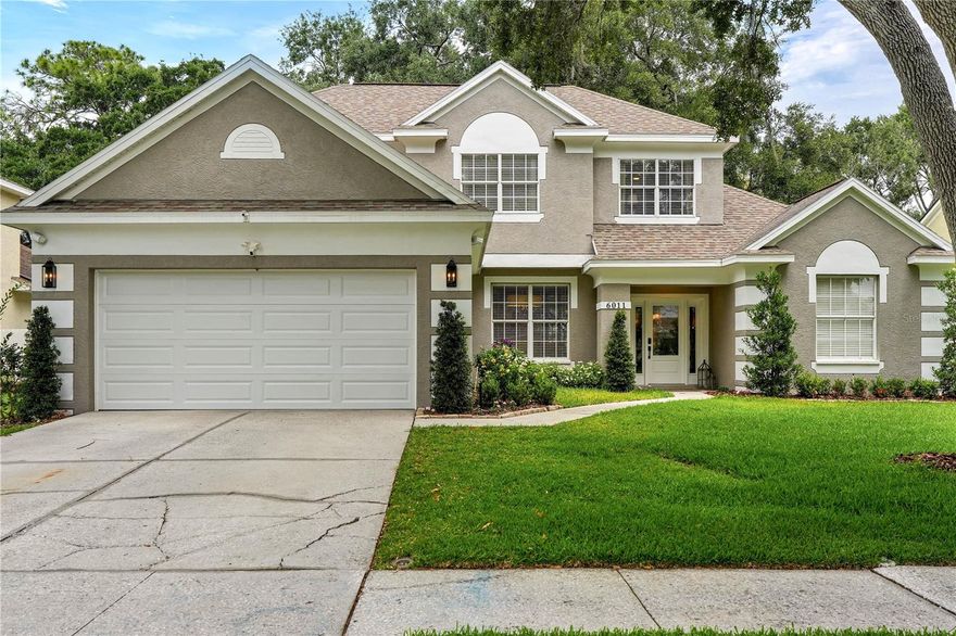 Located within the gated community of Carrollwood Reserve, this beautifully renovated 3-bedroom, 2.5-bath residence offers a refined blend of luxury, comfort, and thoughtful design. The home features a redesigned layout with expanded kitchen and primary suite spaces, creating an effortless flow for both entertaining and everyday living. The stunning custom kitchen is a true centerpiece, showcasing Wellborn shaker cabinetry, full-height upper cabinets, quartz countertops, a stained wood island with seating, designer lighting, touchless Brizo fixtures, and premium GE stainless steel appliances including dual dishwashers. Wide-plank engineered white oak flooring extends throughout the first floor, complemented by curated details such as custom wainscoting, matte black hardware, plantation shutters, and elegant designer lighting throughout the home. The first-floor primary suite serves as a private retreat with a custom walk-in closet and a spa-inspired bath featuring a freestanding soaking tub, oversized frameless glass shower, polished nickel fixtures, quartz-topped double vanity, and striking checkerboard tile flooring. Upstairs, generously sized secondary bedrooms and an updated hall bath provide comfortable accommodations for family and guests, while the loft with custom built-in shelving offers flexible space for a home office, media room, or reading retreat. Additional highlights include a wood-burning fireplace, screened and covered rear porch with expansive sliding glass doors, and a beautifully landscaped, fully fenced backyard offering the perfect balance of sun and shade. Smart-home upgrades include app-controlled ceiling fans, Ring doorbell, upgraded irrigation with WiFi controls, landscape lighting, and security lighting. Perfectly positioned near Tampa’s premier shopping, dining, entertainment, and major commuter routes, this exceptional Carrollwood Reserve home delivers elevated living with timeless style, modern functionality, and an impressive level of detail throughout.