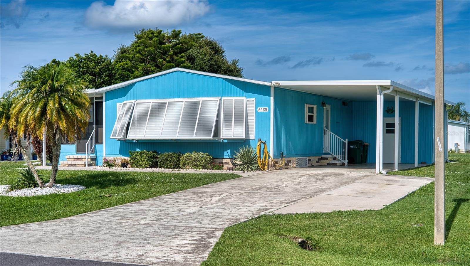 Beautifully Updated Furnished Home in the friendly community of Lemon Bay Isles– You Own the Land!
Welcome to Paradise in Lemon Bay Isles, a highly sought-after 55+ community in sunny Englewood, FL, where you own the land so you pay no Lease on the lot, you pay only a low annual HOA fee of just $50, but you can join The Club for a separate annual fee to enjoy all of the rest of the amenities the community has to offer. Located just 3 miles from the pristine beaches of Manasota Key, this spacious and beautifully maintained and updated 2-bedroom, 2-bath manufactured home is move-in ready and fully furnished— as seen in the photos!
Step inside and you’ll immediately appreciate the updates and attention to detail. The bathrooms have been updated, floors have been upgraded with plywood subflooring and new laminate throughout, while the remodeled kitchen features modern cabinetry, updated countertops, and newer appliances—perfect for anyone who loves to cook or entertain.
The mini/ air-conditioned Florida Room offers a generous additional living space to relax or host guests, and every wall has been drywalled for greatly improved insulation of the whole home. Enjoy peace of mind with a newer roof and carport, and a home that shines with pride of ownership—excellent condition inside and out! 4 point Inspection has just been completed for a Buyers peace of mind, and is available for viewing. Udated room dimensions are listed in the virtual tour, dimensions listed above are estimates from public records and may not be exact, buyer to verify.
Located just 15 minutes from the charm of Venice, and about 45 minutes to the cultural hub of Sarasota, this is Florida living at its best—affordable, active, and just minutes from world-class beaches, golf, shopping, and dining.
Don’t miss your opportunity to own this exceptional home in one of Englewood’s most desirable communities. Schedule your showing today!