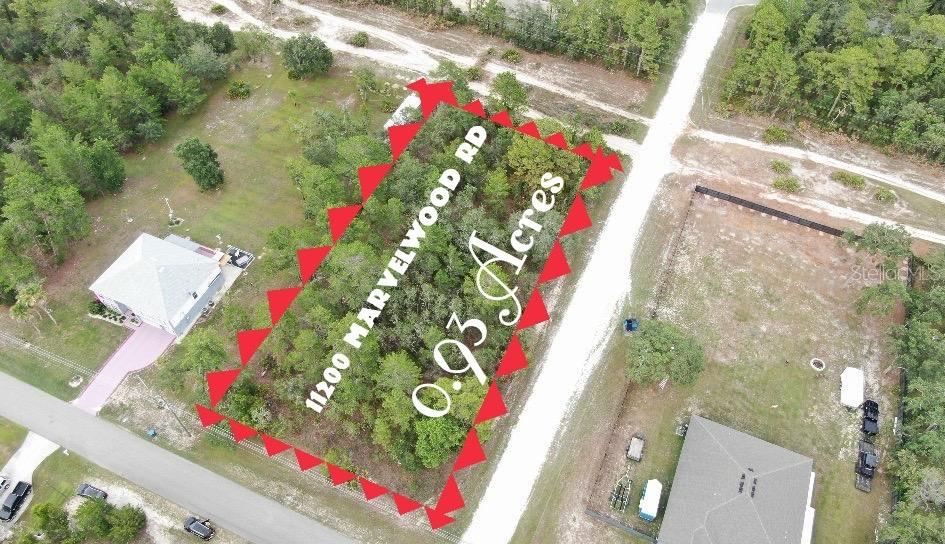 Really Big Royal Highlands corner lot for sale on a Paved Road. Only borders one neighbor. Front, Back, and on one side streets. Nestled in the heart of Hernando County, this expansive 0.93-acre vacant lot offers the perfect opportunity to build your dream home. NO Flood Insurance needed, NO HOA and no CDD. Buying this lot could save you time and money if you want to own your own home. Don't waste time and come to know this beautiful piece of land in a true natural paradise.Located just a short distance from the natural beauty of Weeki Wachee Springs,Pine Island Beach, Cortez Blvd(50), Restaurants, Walmart, Public, Commercial Way(US 19), SR 98 this property is a true gem for nature lovers and outdoor enthusiasts. Whether you envision a cozy retreat, a vacation getaway, or a full-time residence, this property provides the ideal canvas for your vision. Conveniently situated with easy access to local amenities, parks, and waterfront activities, you'll enjoy the best of both worlds—seclusion and proximity to all that the Gulf Coast has to offer.