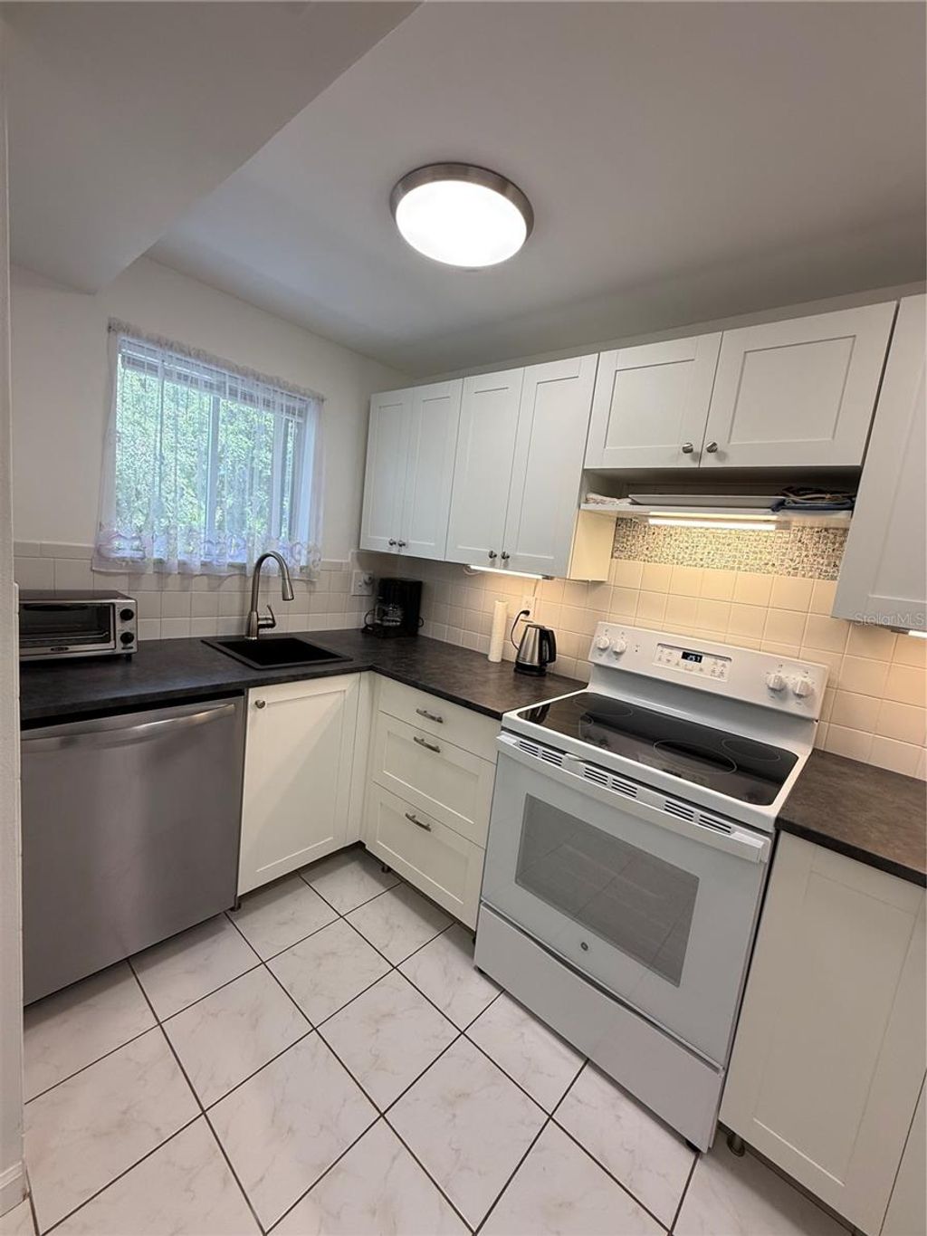 Photo of 1243 S Martin Luther King Jr Avenue #C303, Clearwater, FL 33756 (MLS # TB8518488)