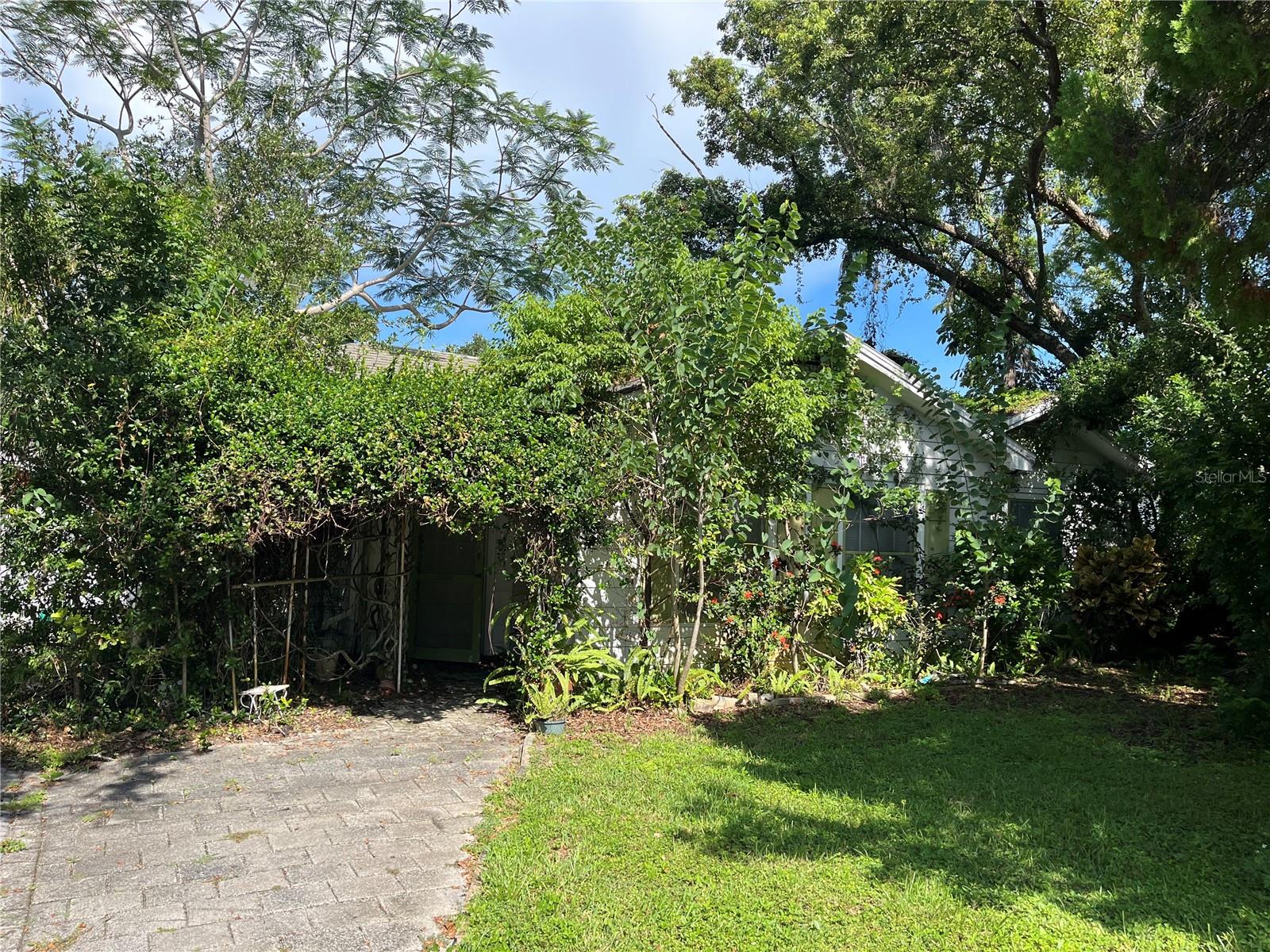 Incredible Investment Opportunity in Clearwater! Nestled on over half an acre in a desirable, established neighborhood, this spacious property offers endless potential. Priced at land value, it presents a rare chance to build your dream home or transform the existing structure into a private tropical oasis. Whether you're an investor, developer, or visionary homeowner, this is your canvas to create something truly special. Enjoy the convenience of being close to beaches, shopping, dining, and top-rated schools—all while having the privacy and space that’s hard to find in today’s market. Don’t miss out on this hidden gem!