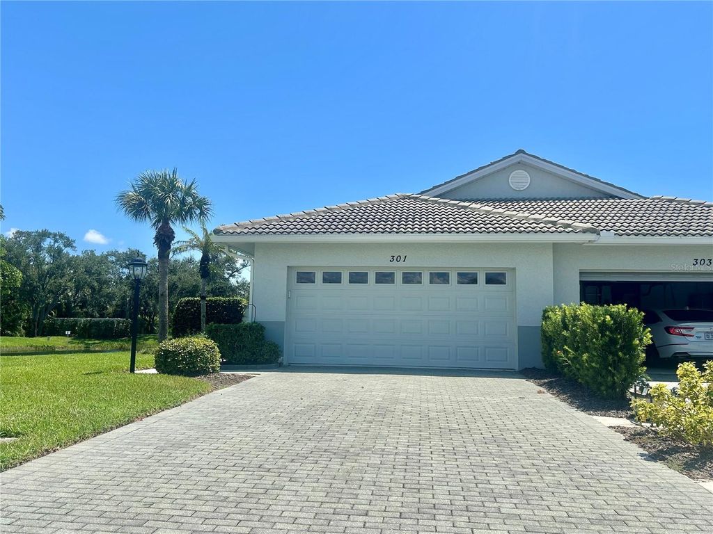 Photo of 301 Reclinata Circle, Venice, FL 34292 (MLS # A4663957)