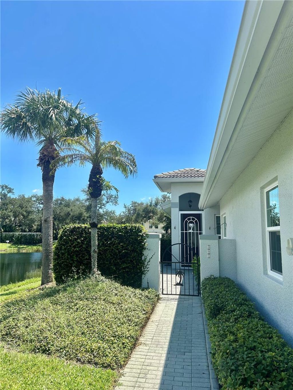 Photo of 301 Reclinata Circle, Venice, FL 34292 (MLS # A4663957)